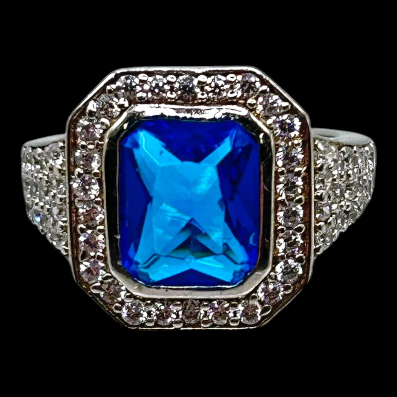 Sterling Silver Emerald Cut Blue Topaz CZ Halo Ring With Octagonal Vintage Inspired Setting: Professional, fast, and affordable in house shipping available for all items.For higher resolution images please visit bid.craftedauctions.com Brilliantly elegant, this sterling silver ring features a
