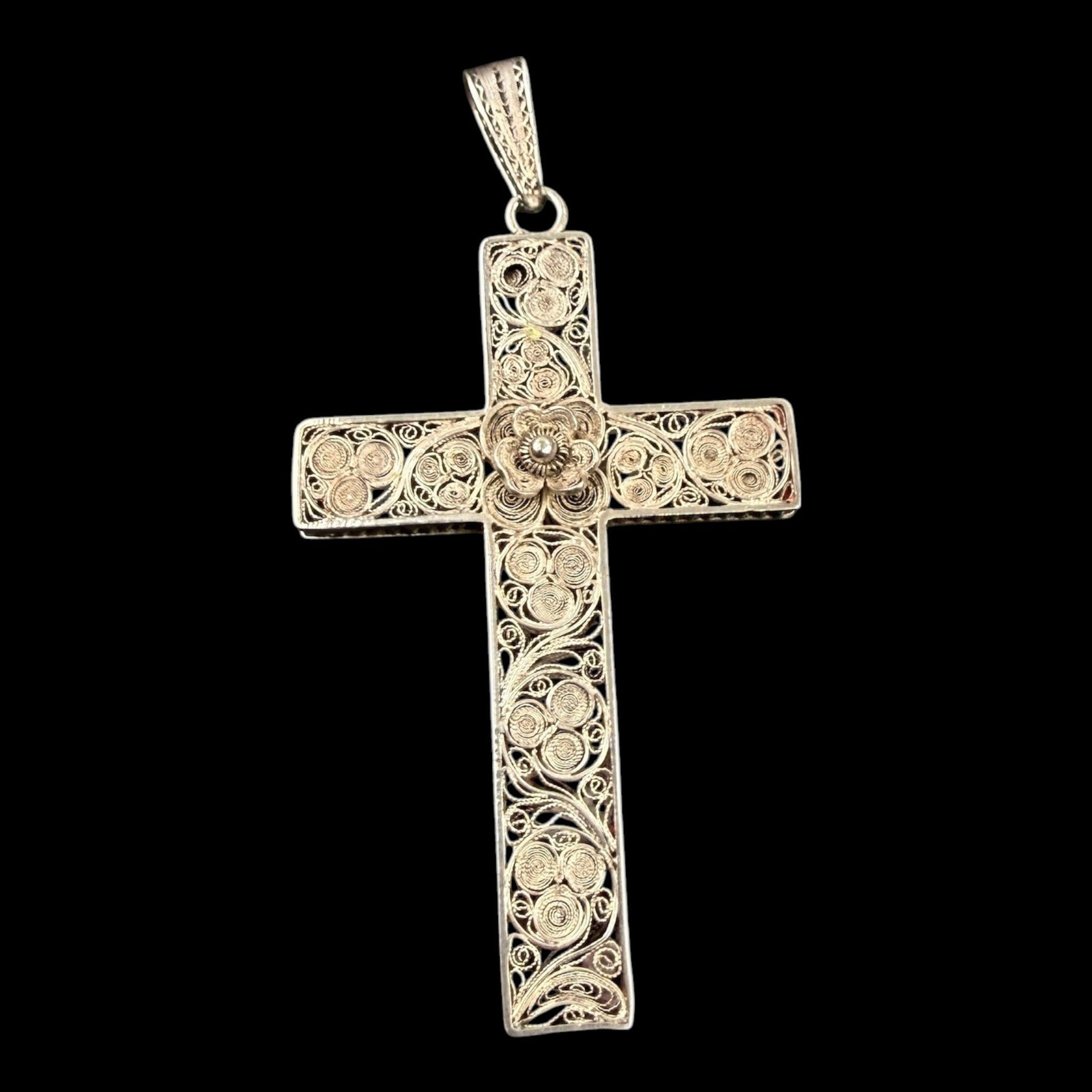Sterling Silver Ornate Filigree Cross Pendant With Floral Center & Hand Wrought Scrollwork Design: Professional, fast, and affordable in house shipping available for all items.For higher resolution images please visit bid.craftedauctions.com Elegantly handcrafted sterling silver cross pendant featu