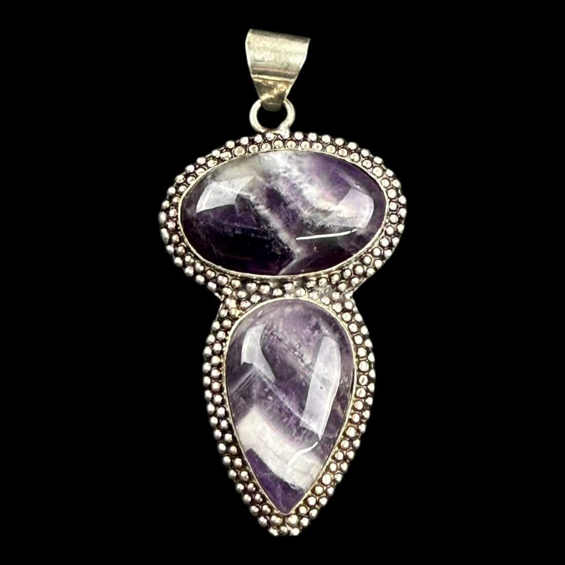Sterling Silver Chevron Amethyst Pendant With Dual Cabochons And Beaded Border Design: Professional, fast, and affordable in house shipping available for all items.For higher resolution images please visit bid.craftedauctions.com Distinctively crafted, this sterling silver pendant featu