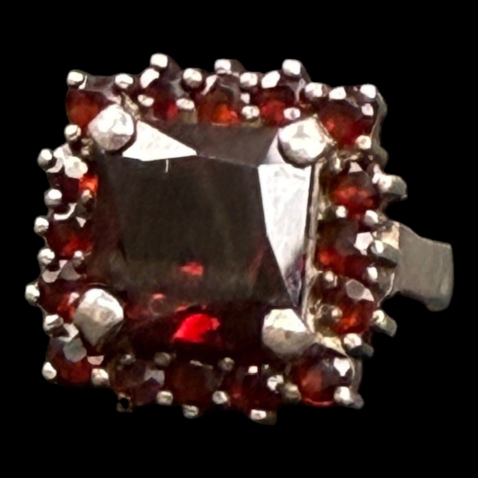Sterling Silver Garnet Cluster Ring With Emerald Cut Center And Halo Statement Design: Professional, fast, and affordable in house shipping available for all items.For higher resolution images please visit bid.craftedauctions.com Richly colored, this sterling silver ring features an eme