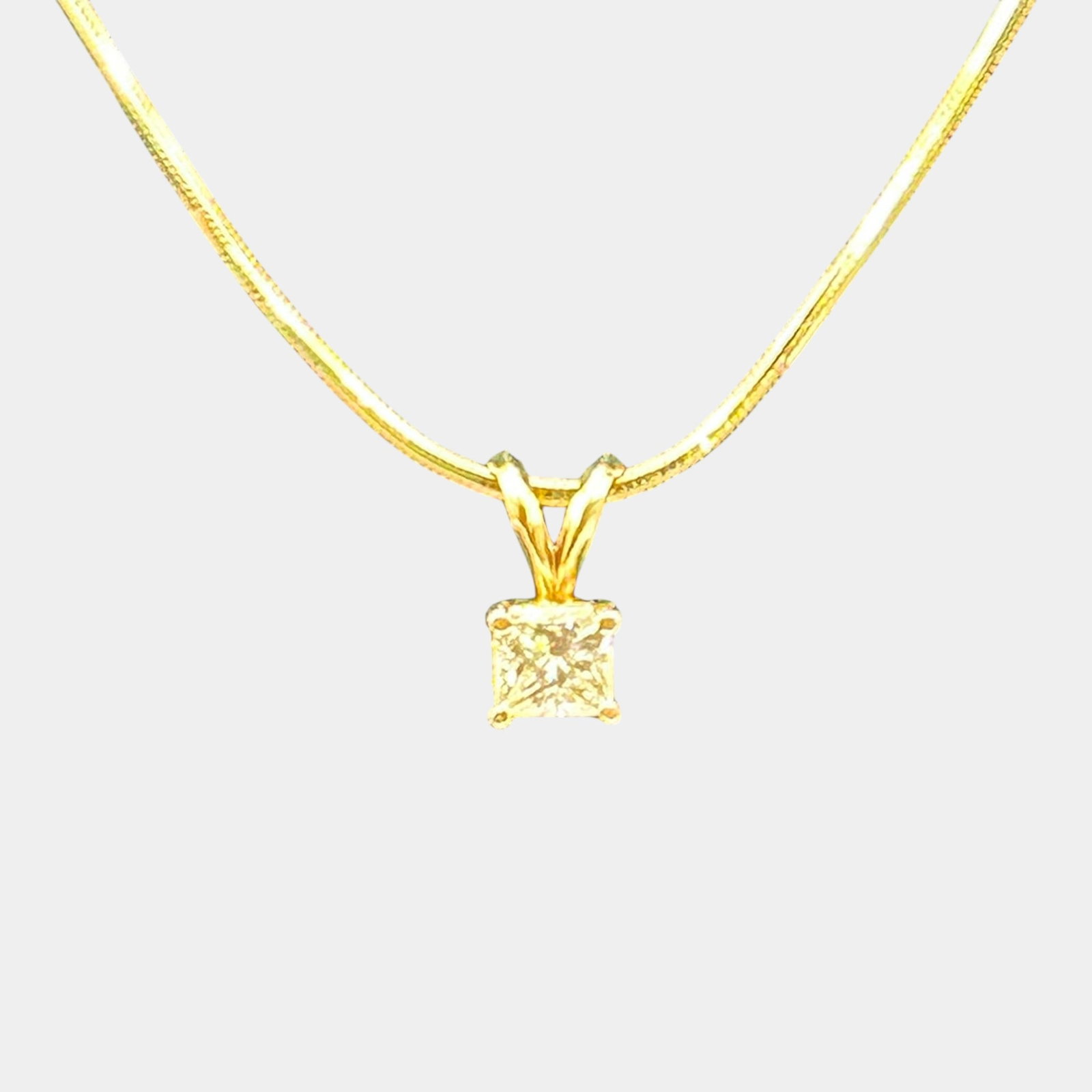 14K Yellow Gold And 0.75 ct Princess Cut Diamond Pendant On Herringbone Chain Necklace 18 Inches: Professional, fast, and affordable in house shipping available for all items. For higher resolution images please visit bid.craftedauctions.com Elegantly styled 14K gold necklace featuring a sleek her