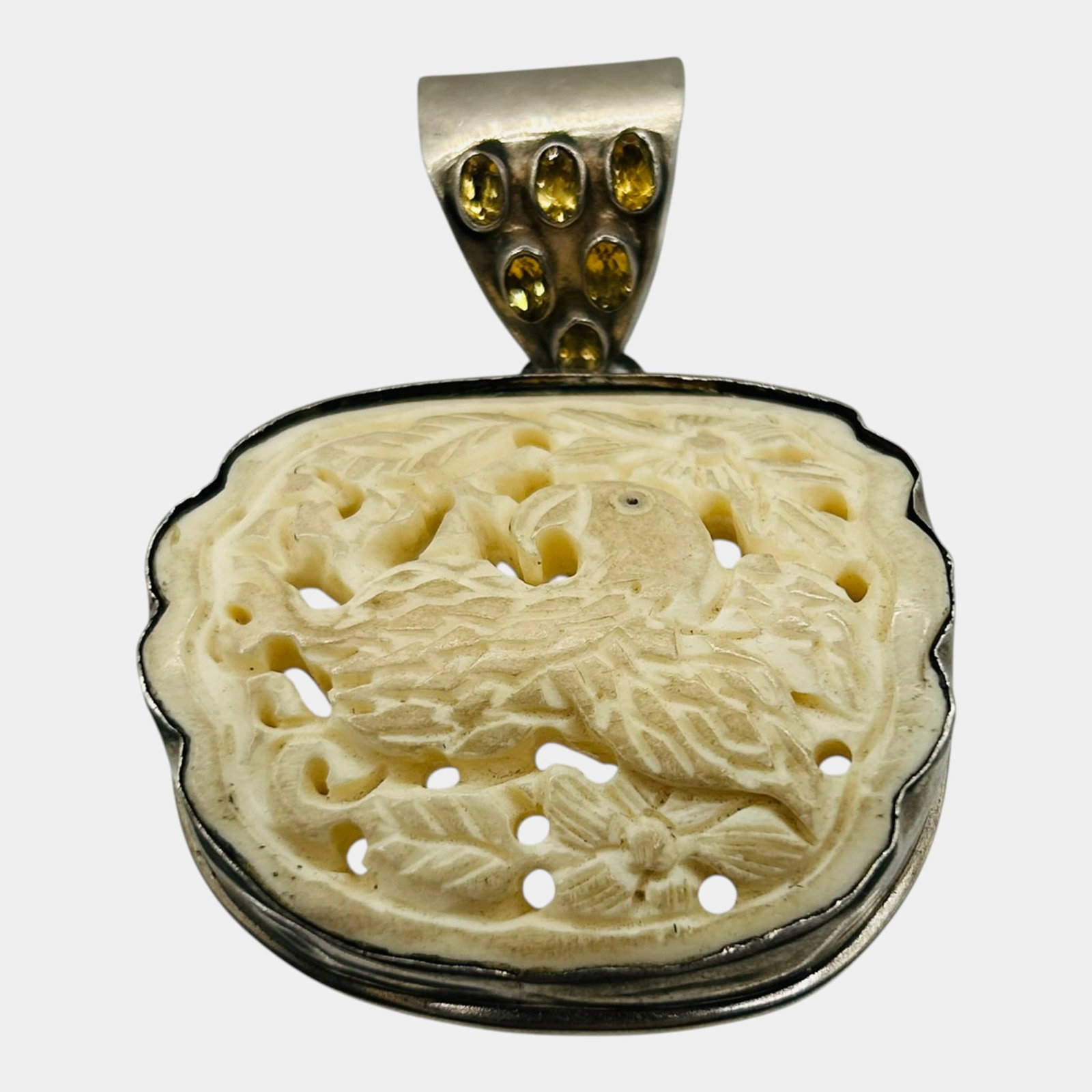 Sterling Silver Carved Bone Bird Pendant With Citrine Accent Bale Openwork Design: Professional, fast, and affordable in house shipping available for all items. For higher resolution images please visit bid.craftedauctions.com Intricately carved, this sterling silver pendant feature