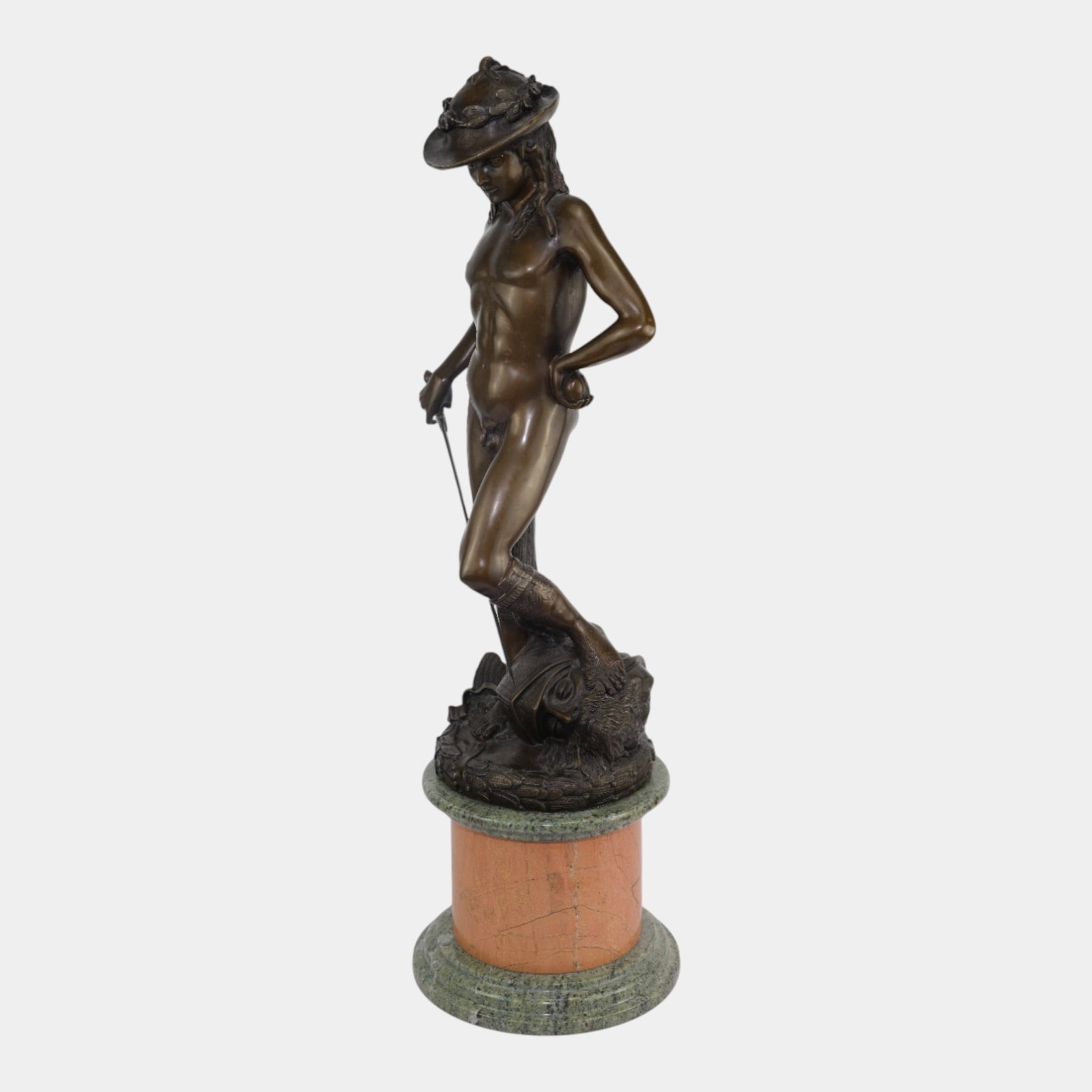 After Donatello Vintage Bronze Sculpture "David" Mounted On Marble Stand: Professional, fast, and affordable in house shipping available for all items. For higher resolution images please visit bid.craftedauctions.com After Donatello Vintage Bronze Sculpture "David" Mounted