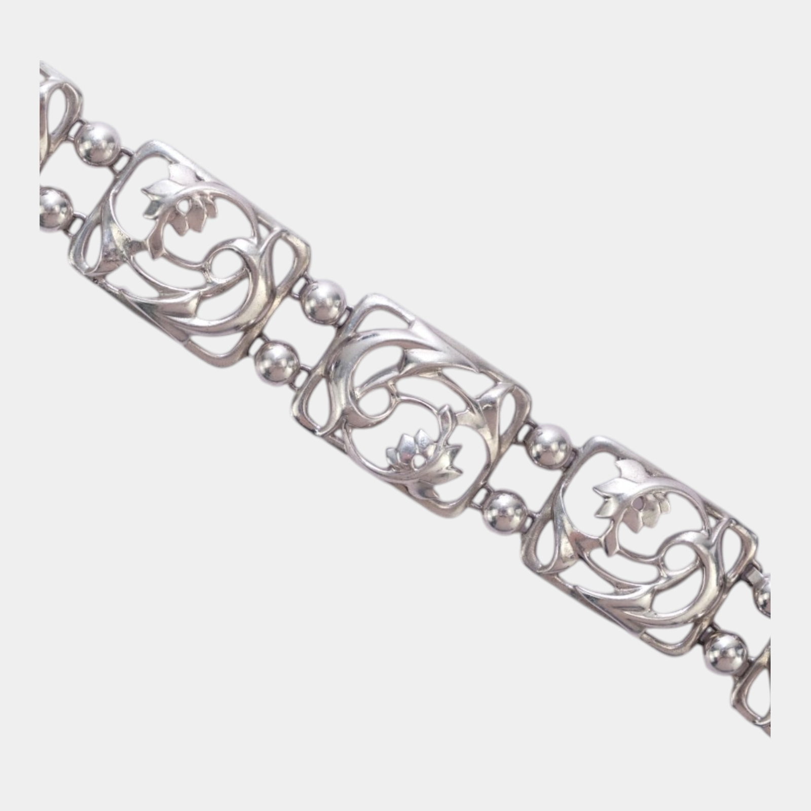 Simmons Silver Mid Century Modern Sterling Silver Floral And Leaf Panel Link Bracelet: Professional, fast, and affordable in house shipping available for all items. For higher resolution images please visit bid.craftedauctions.com Elegantly detailed and organically styled, this sterling