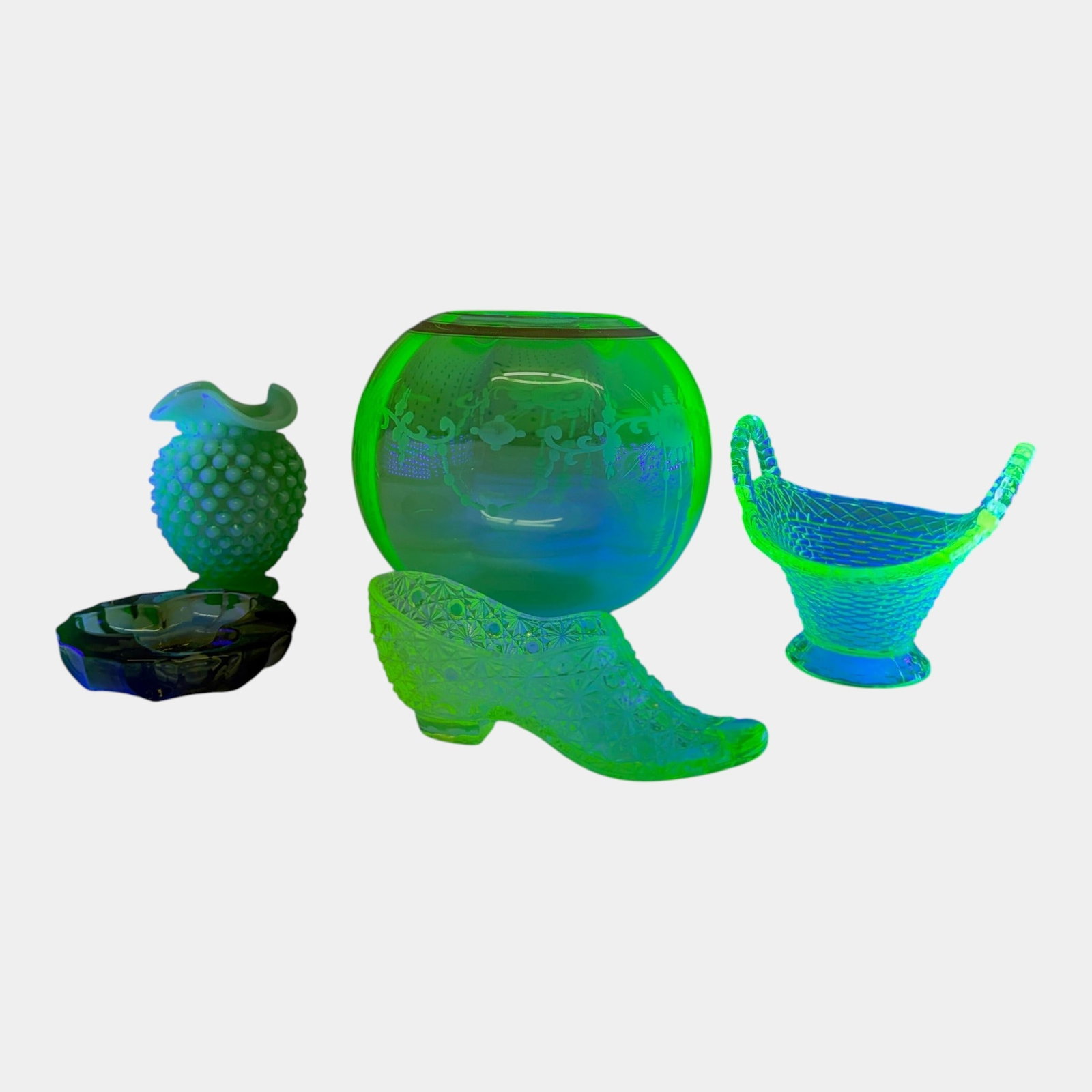 Fenton Opalescent Hobnail Vase, Fenton Stars & Buttons Shoe, & Other Green Uranium Glass Glass: Professional, fast, and affordable in house shipping available for all items. For higher resolution images please visit bid.craftedauctions.com Fenton Opalescent Hobnail Vase, Fenton Stars & Buttons S