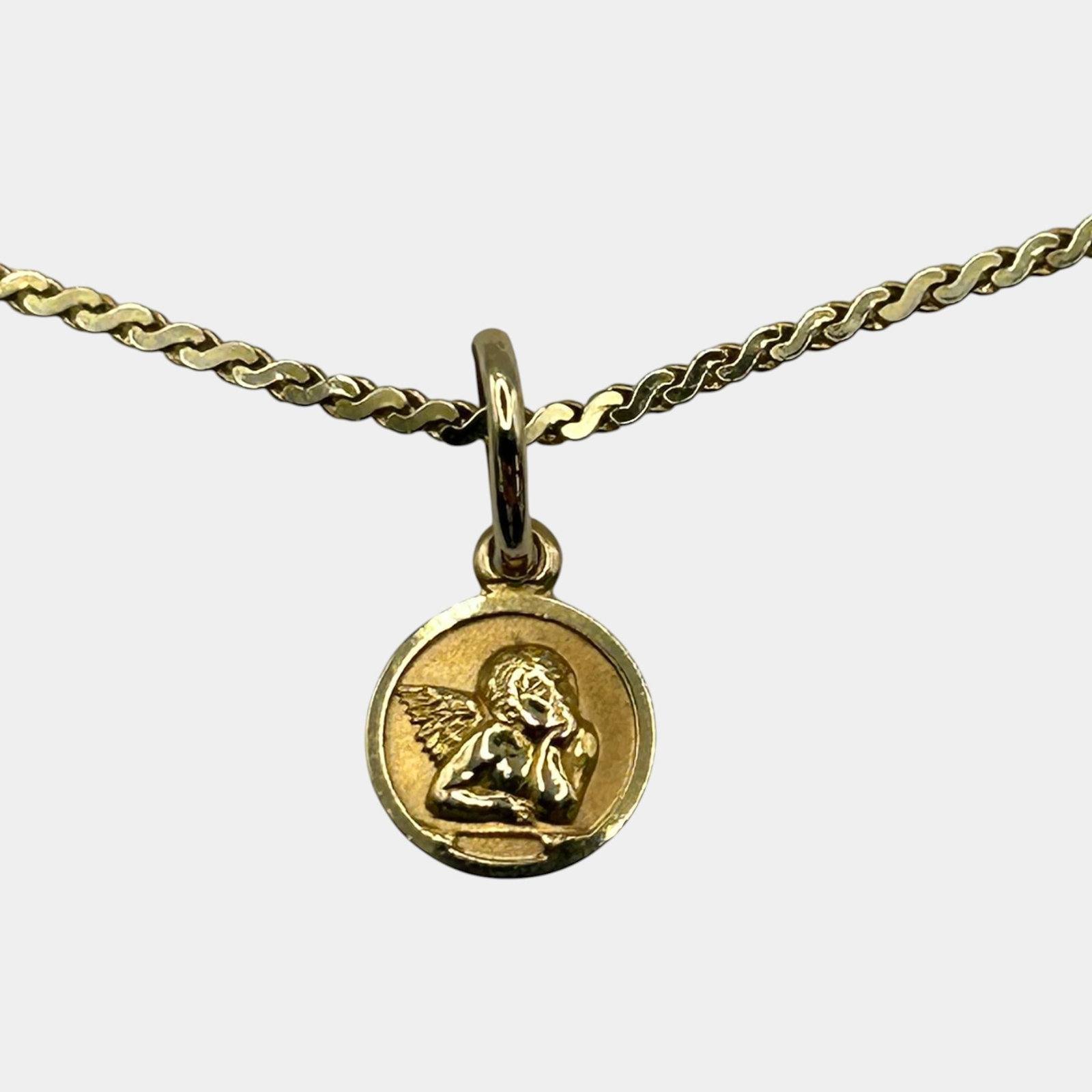 14K Yellow Gold Cherub Angel Medallion Pendant On Gold Chain Necklace: Professional, fast, and affordable in house shipping available for all items. For higher resolution images please visit bid.craftedauctions.com Beautifully crafted 14K gold necklace featuring a round 