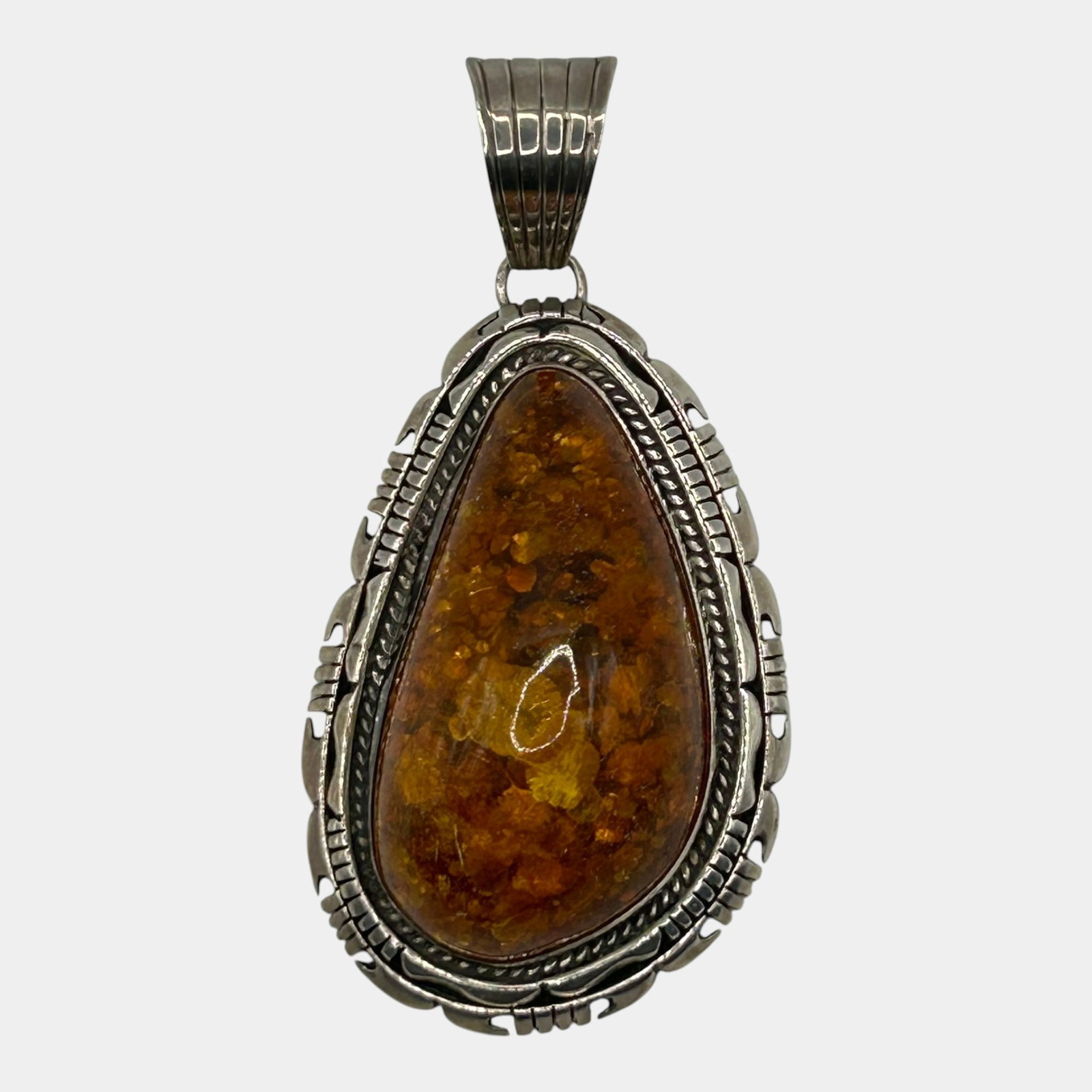 Gary Spencer Navajo Native American Sterling Silver Braided Bezel Large Amber Cabochon Slide Pendant: Professional, fast, and affordable in house shipping available for all items. For higher resolution images please visit bid.craftedauctions.com Richly detailed, this Gary Spencer Navajo sterling silve