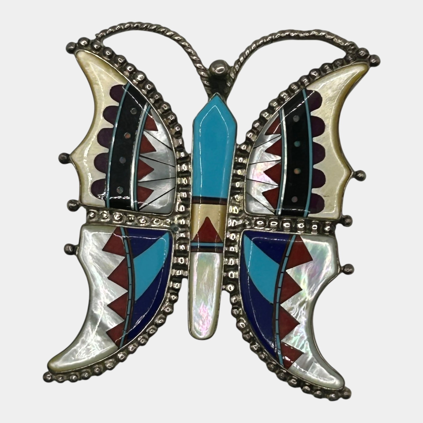 MB Zuni Native American Sterling Silver Multi-Stone Inlay Butterfly Brooch Pendant: Professional, fast, and affordable in house shipping available for all items. For higher resolution images please visit bid.craftedauctions.com Finely detailed, this Zuni sterling silver butterfly bro