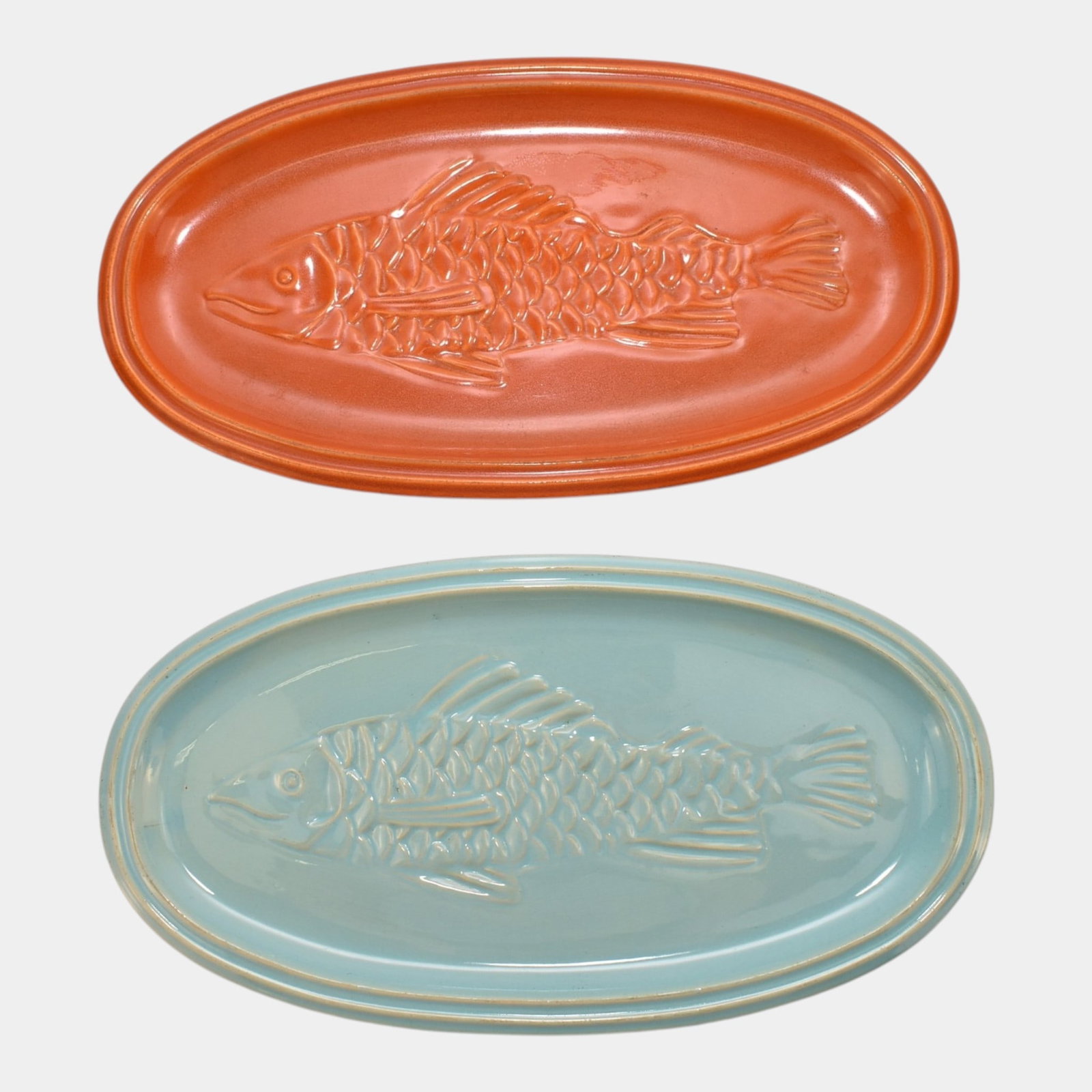 Pacific Pottery 1930s California Art Deco Orange & Blue Fish Relief Serving Platters Pair: Professional, fast, and affordable in house shipping available for all items. For higher resolution images please visit bid.craftedauctions.com Pacific Pottery 1930s California Art Deco Orange & Blue 