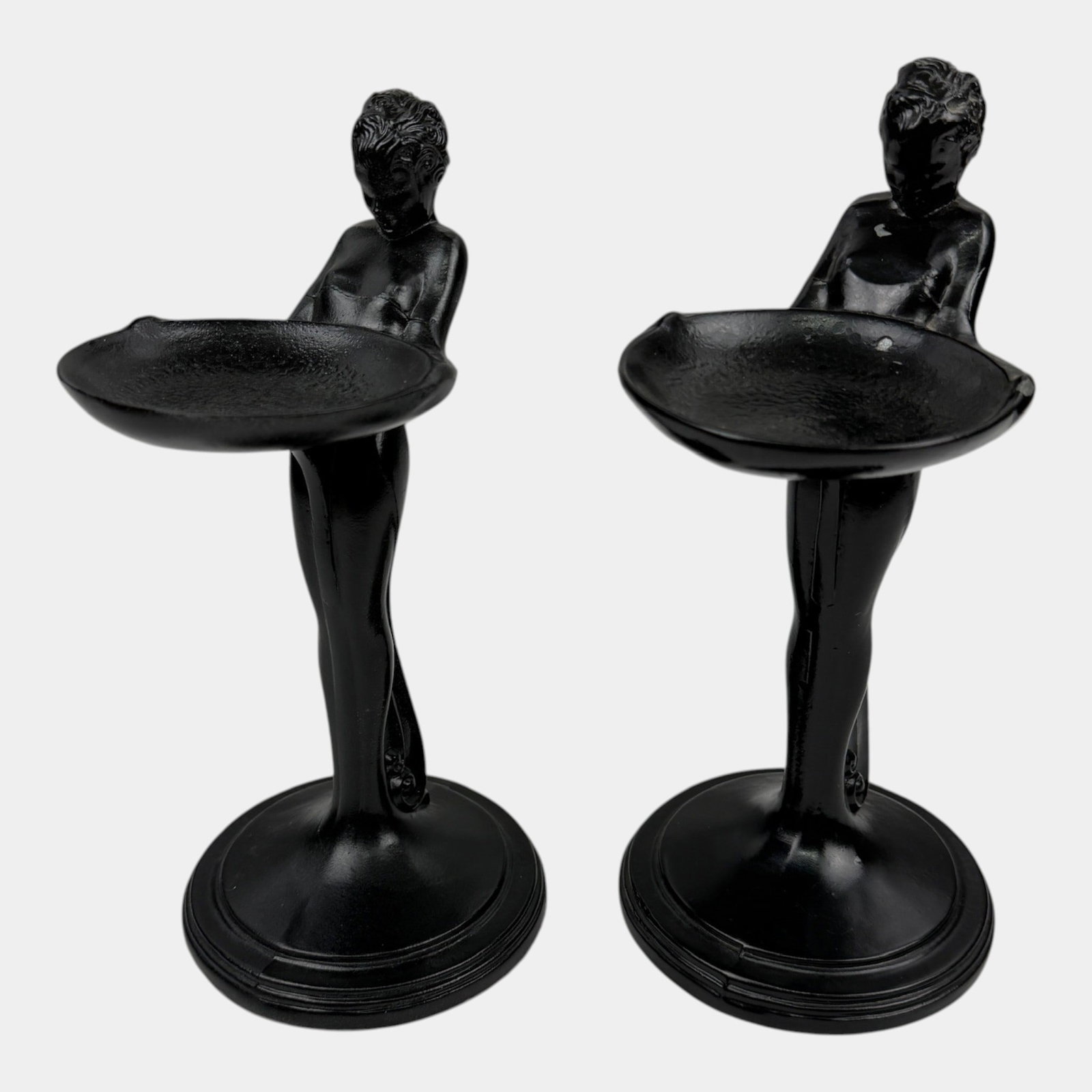 Frankart 1920s Art Deco Black Metal Standing Nude Holding Dish Ash Tray Pair: Professional, fast, and affordable in house shipping available for all items. For higher resolution images please visit bid.craftedauctions.com Frankart 1920s Art Deco Black Metal Standing Nude Holdin