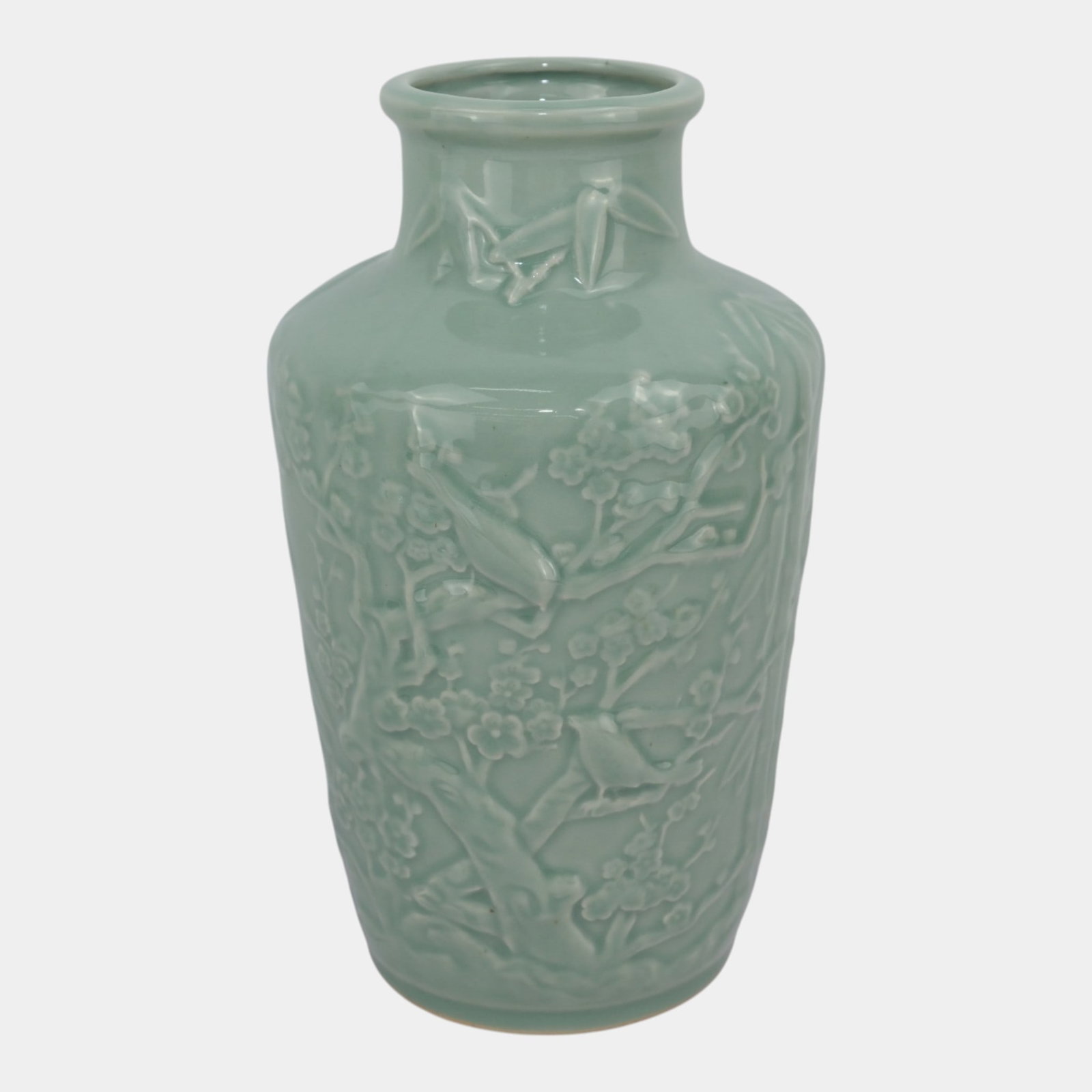 Chinese 1950s Celadon Green Glazed Relief Molded Birds & Prunus Blossoms Large Porcelain Baluster: Professional, fast, and affordable in house shipping available for all items. For higher resolution images please visit bid.craftedauctions.com Chinese 1950s Celadon Green Glazed Relief Molded Birds &
