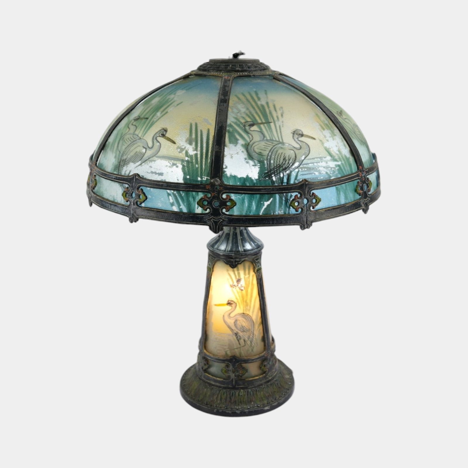 Early 20th Century Arts And Crafts Reverse Painted Egrets Among Weeds Shade & Base Table Lamp: Professional, fast, and affordable in house shipping available for all items. For higher resolution images please visit bid.craftedauctions.com Early 20th Century Arts And Crafts Reverse Painted Egret