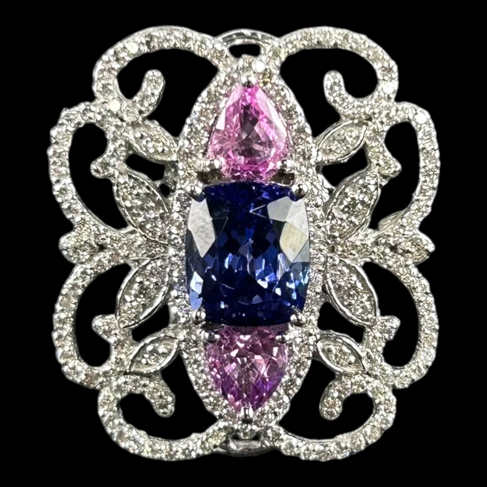 14K White Gold Brilliant Tanzanite & Pear Cut Sapphire With 1.19ctw Brilliant Cut Diamond Ring: Professional, fast, and affordable in house shipping available for all items. For higher resolution images please visit bid.craftedauctions.com Lavishly ornate, this 14K white gold ring centers a bril