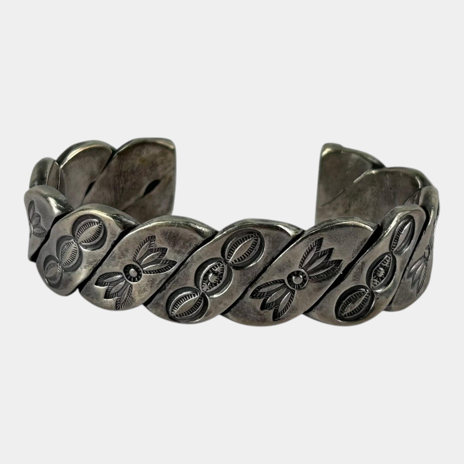 Navajo Native American Sterling Silver Hand Stamped Scalloped Panel Cuff Bracelet: Professional, fast, and affordable in house shipping available for all items. For higher resolution images please visit bid.craftedauctions.com Expertly handcrafted Navajo sterling silver cuff featuri