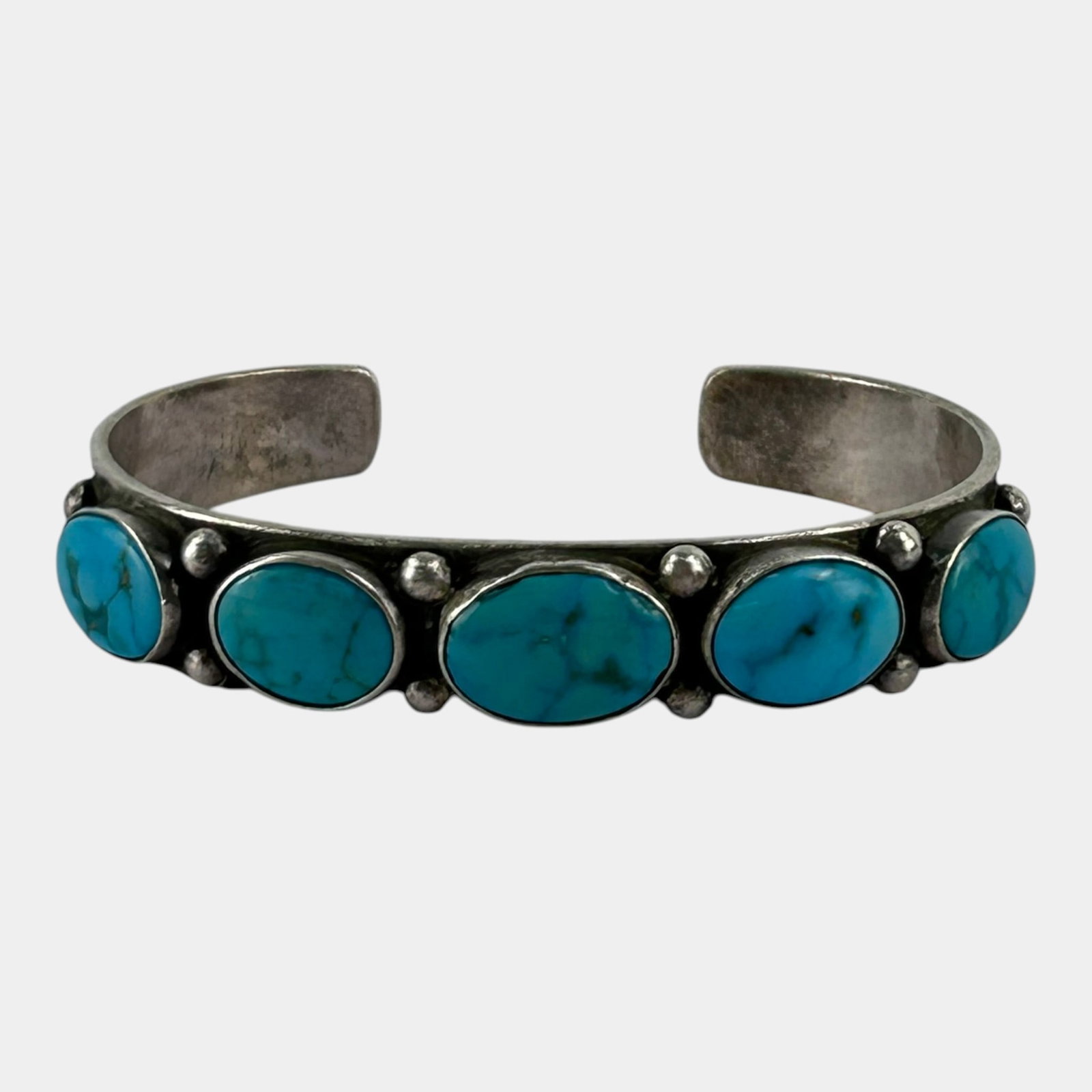 Native American Sterling Silver Five Stone Turquoise Row Cuff Bracelet Southwestern Jewelry: Professional, fast, and affordable in house shipping available for all items. For higher resolution images please visit bid.craftedauctions.com Boldly handcrafted Native American sterling silver cuff 