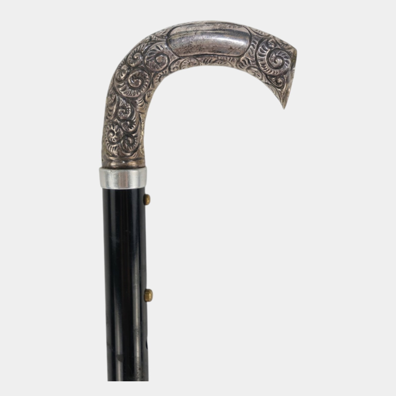 Sterling Silver Adjustable Black Metal Walking Cane With RepoussÃ© Silver Crook Handle: Professional, fast, and affordable in house shipping available for all items. For higher resolution images please visit bid.craftedauctions.com Sterling Silver Adjustable Black Metal Walking Cane With