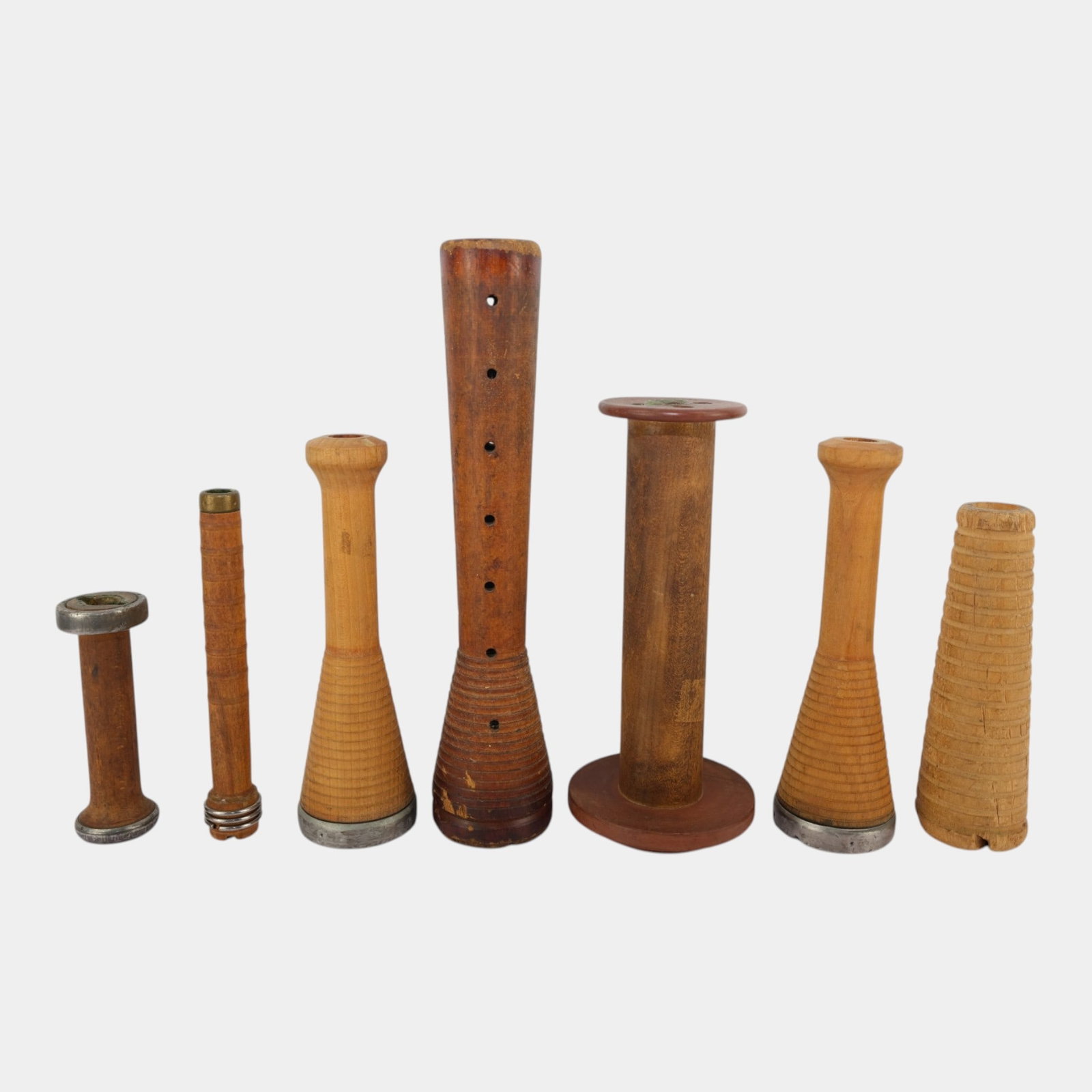 Collection of Antique Wooden Industrial Textile Bobbins, Spools & Flute Weaving Tools: Professional, fast, and affordable in house shipping available for all items. For higher resolution images please visit bid.craftedauctions.com Collection of Antique Wooden Industrial Textile Bobbins,