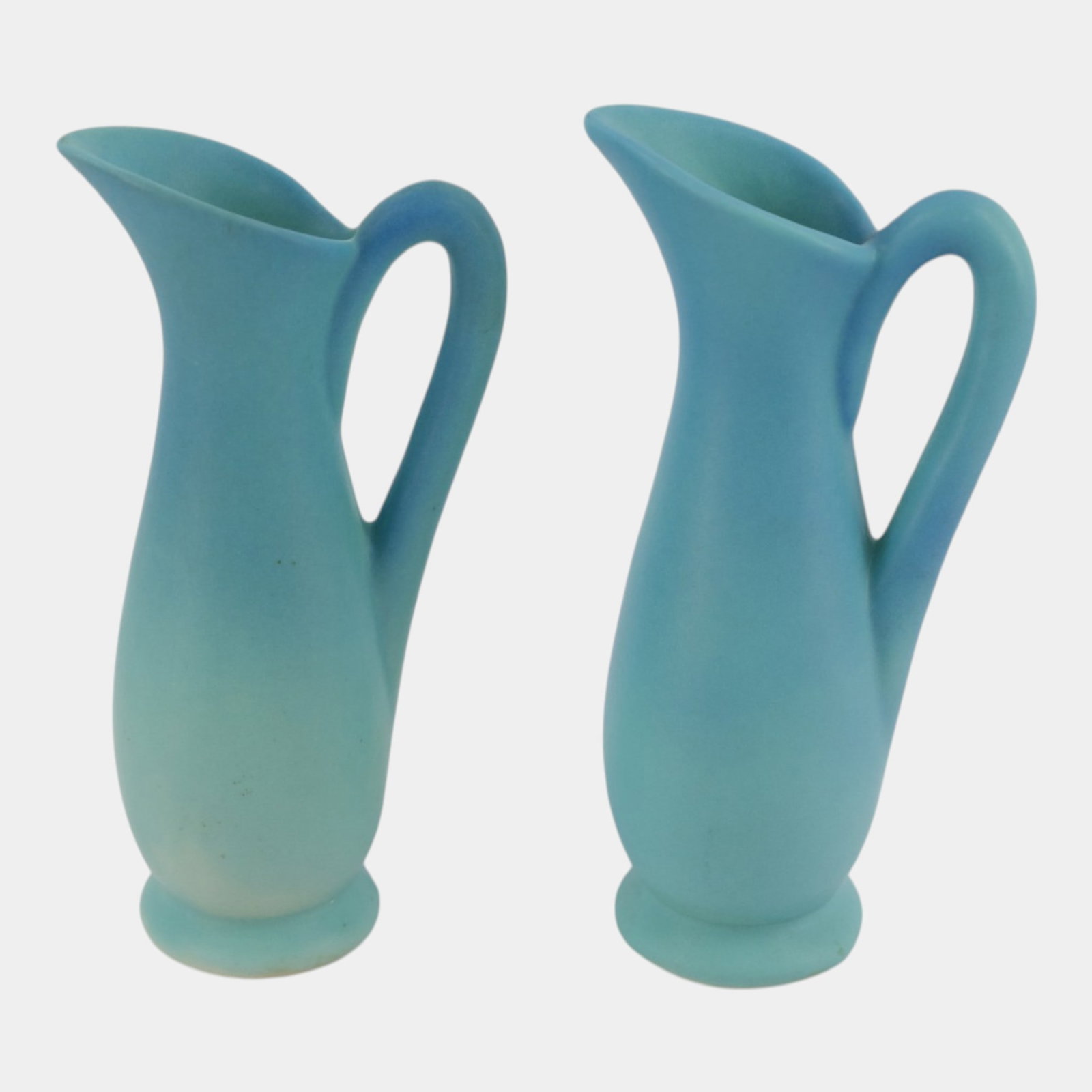 Van Briggle Pottery Matte Turquoise Ewers Pair Art And Crafts Handled Pitchers Ewers Group Of Two: Professional, fast, and affordable in house shipping available for all items. For higher resolution images please visit bid.craftedauctions.com Van Briggle Pottery Matte Turquoise Ewers Pair Art And C