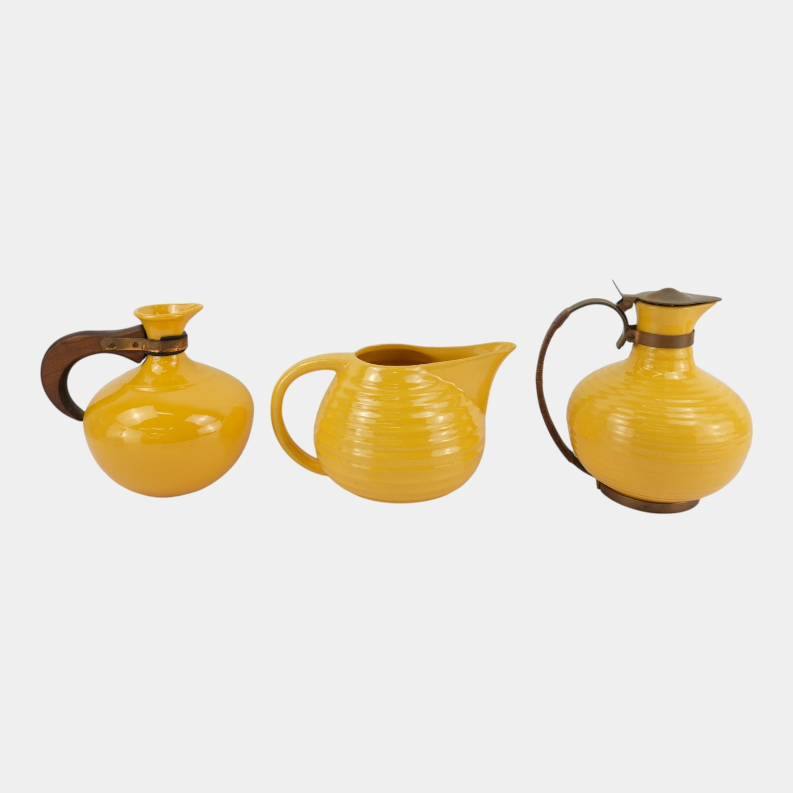 Bauer Los Angeles California Deco Pottery Yellow Ringware Carafes & Pitcher Wood Metal Handles: Professional, fast, and affordable in house shipping available for all items. For higher resolution images please visit bid.craftedauctions.com Bauer Los Angeles California Deco Pottery Yellow Ringwar