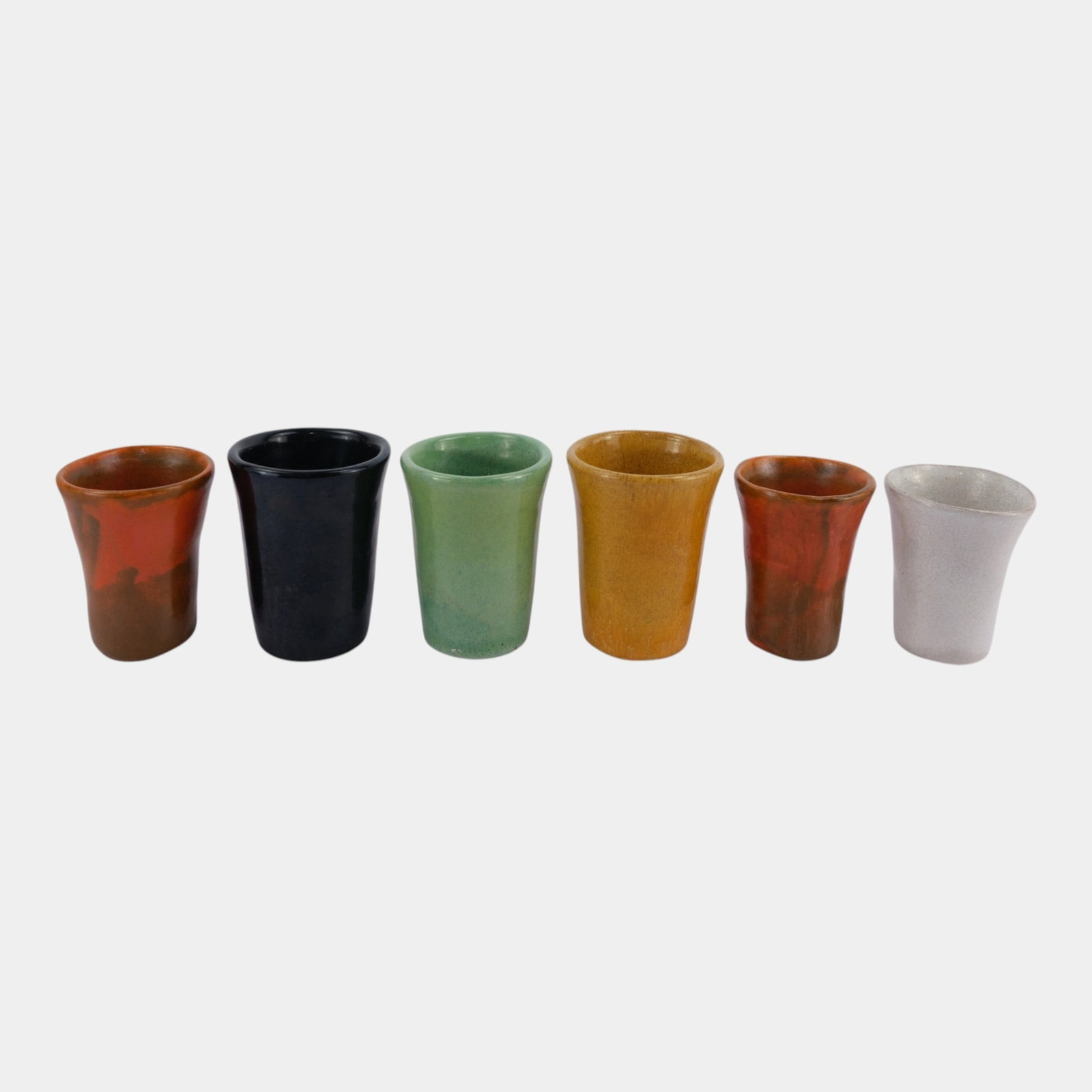 Brayton Laguna California Mid Century Art Pottery Miniature Tumbler Shot Glass Collection: Professional, fast, and affordable in house shipping available for all items. For higher resolution images please visit bid.craftedauctions.com Brayton Laguna California Mid Century Art Pottery Miniat