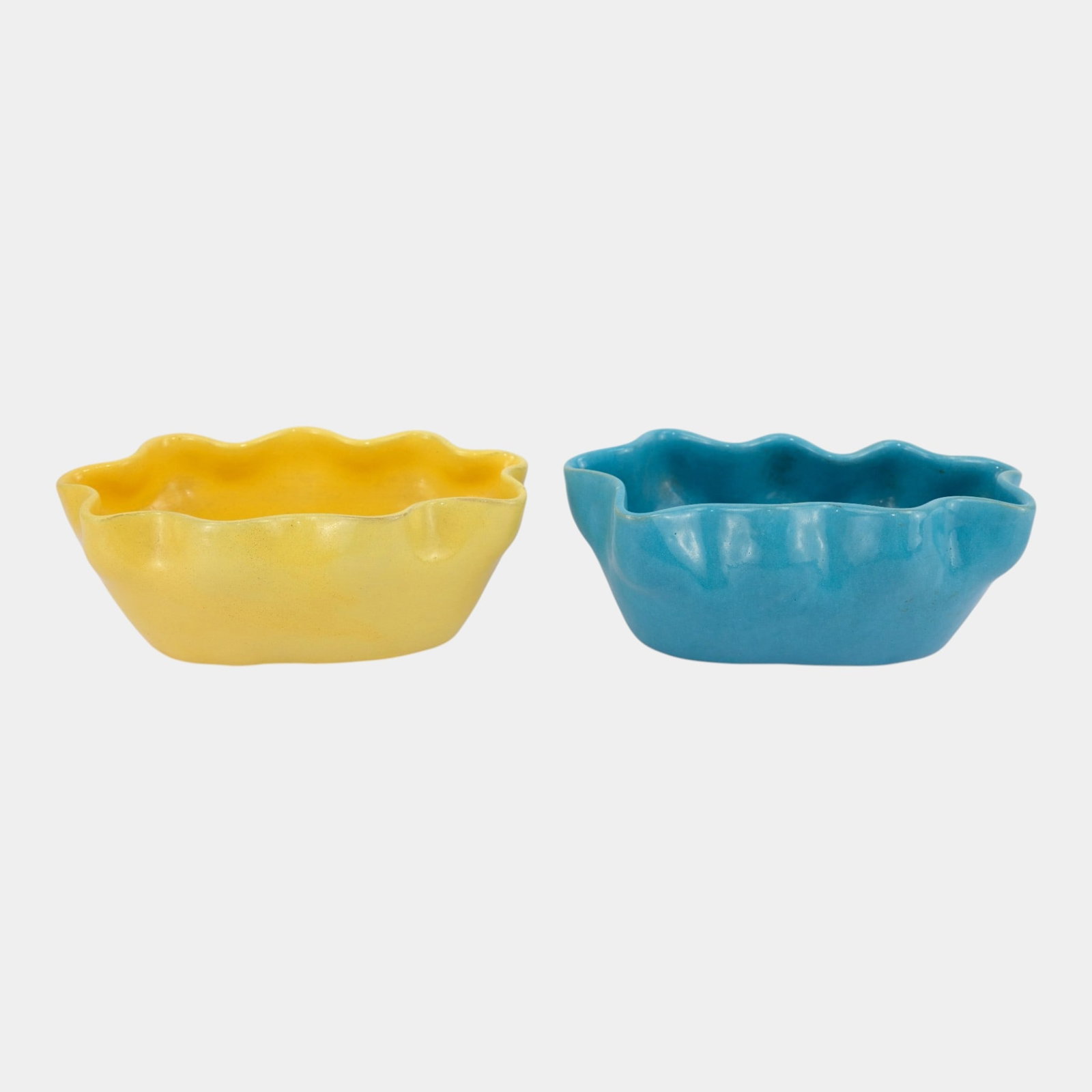 Brayton Laguna California Mid Century Blue & Yellow Scalloped Art Pottery Console Bowls Pair: Professional, fast, and affordable in house shipping available for all items. For higher resolution images please visit bid.craftedauctions.com Brayton Laguna California Mid Century Blue & Yellow Scal