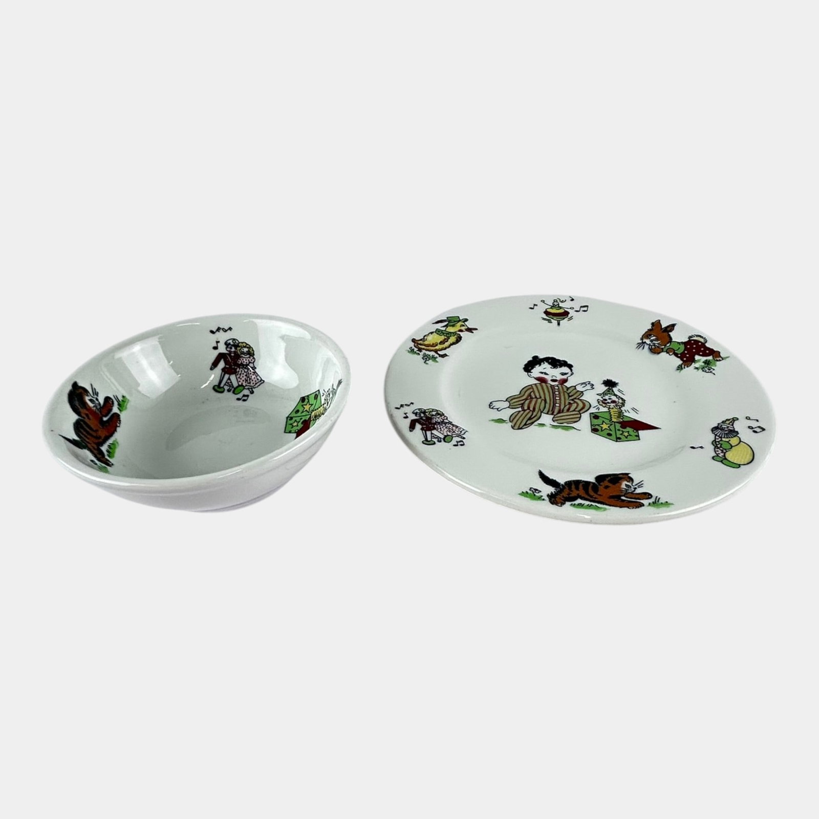 Mayer China 1950s White Whimsical Toyland Pattern Children's Plate & Bowl: Professional, fast, and affordable in house shipping available for all items. For higher resolution images please visit bid.craftedauctions.com Mayer China 1950s White Whimsical Toyland Pattern Childr