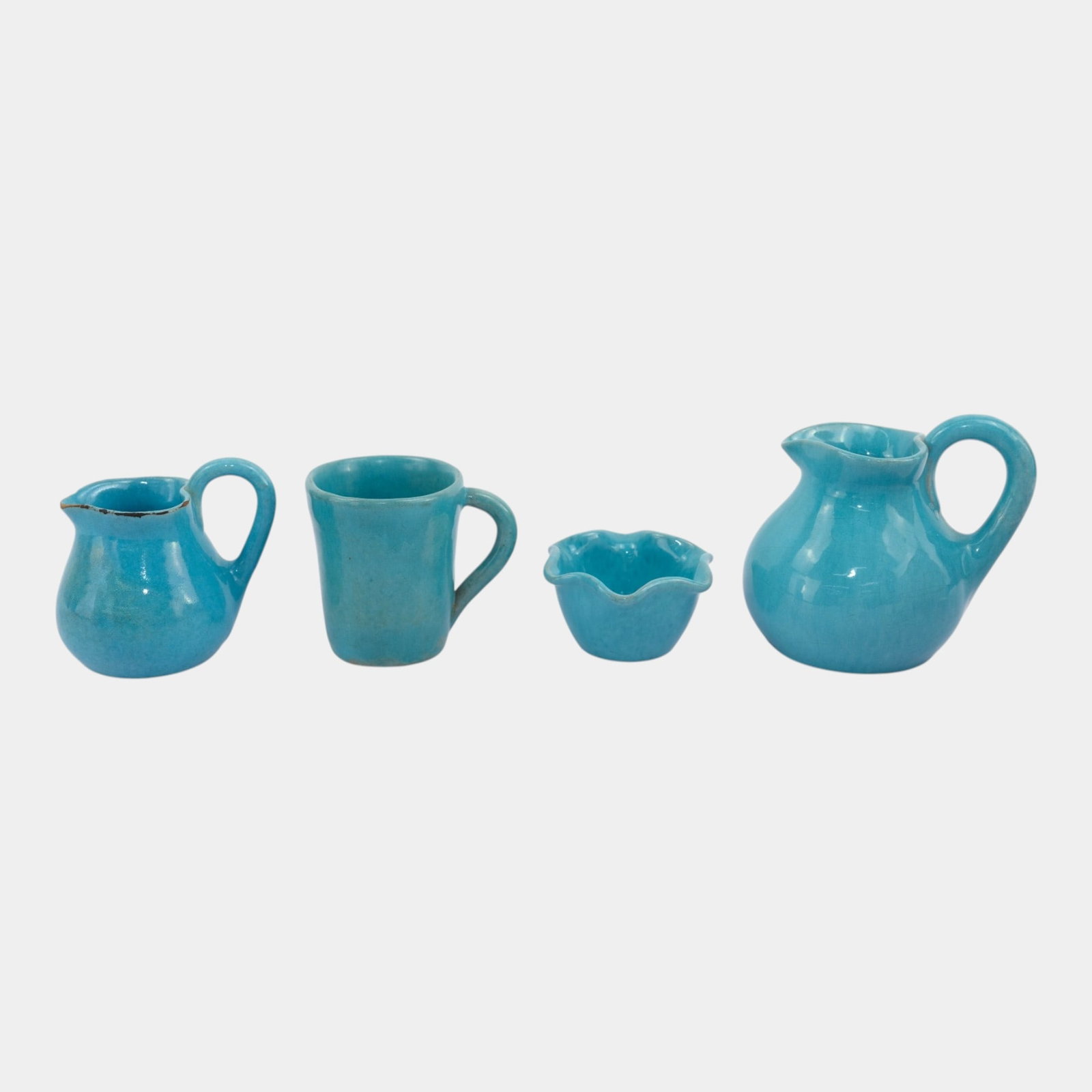 Brayton Laguna California Mid Century Turquoise Miniature Art Pottery Bowl, Mug, And Pitchers: Professional, fast, and affordable in house shipping available for all items. For higher resolution images please visit bid.craftedauctions.com Brayton Laguna California Mid Century Turquoise Miniatur