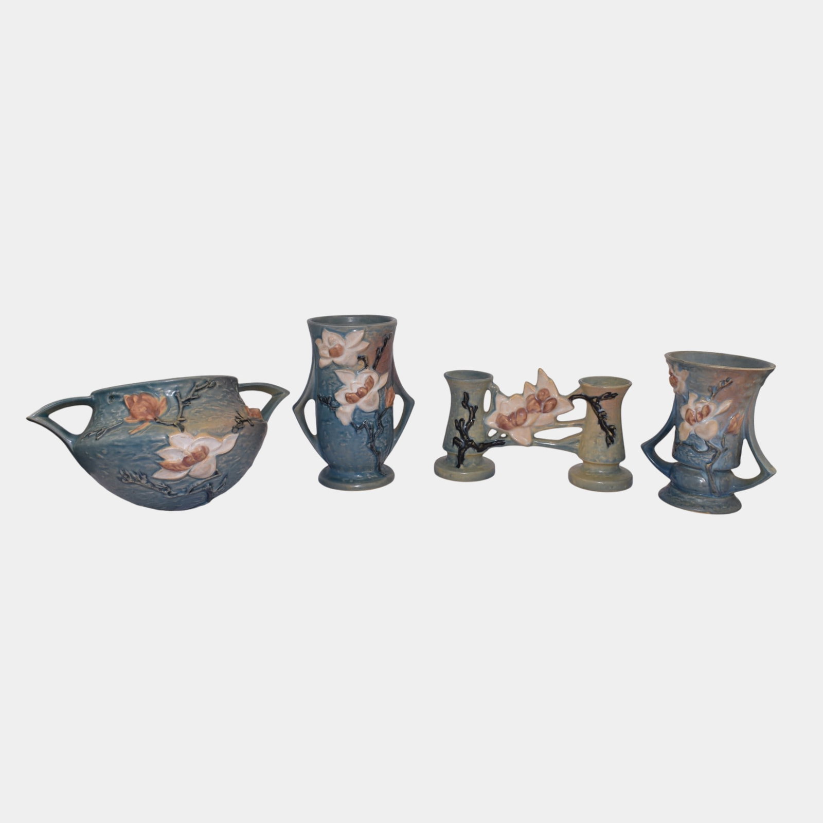 Roseville Magnolia Blue Vintage Art Pottery Ceramic Hanging Basket Vases: Professional, fast, and affordable in house shipping available for all items. For higher resolution images please visit bid.craftedauctions.com Roseville Magnolia Blue Vintage Art Pottery Ceramic Hang