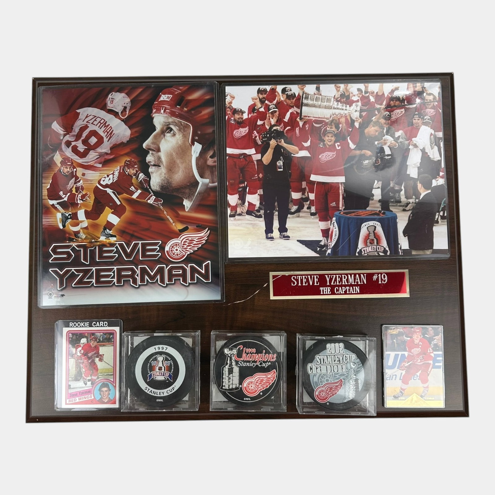 Steve Yzerman Detroit Red Wings Plaque With Rookie Card Stanley Cup Pucks & Photographs: Professional, fast, and affordable in house shipping available for all items. For higher resolution images please visit bid.craftedauctions.com Steve Yzerman Detroit Red Wings Plaque With Rookie Card 