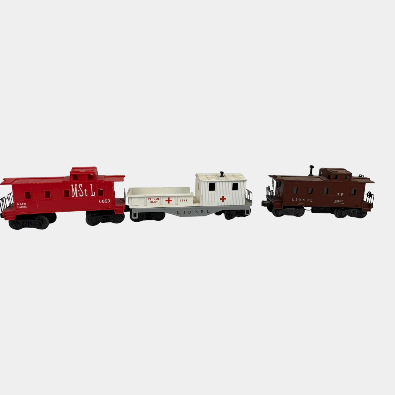 Lionel Trains Post War Red M St L 6059 Caboose, SP Caboose 2357, Rescue Unit 6814 Train Cars: Professional, fast, and affordable in house shipping available for all items. For higher resolution images please visit bid.craftedauctions.com Lionel Trains Post War Red M St L 6059 Caboose, SP Caboo