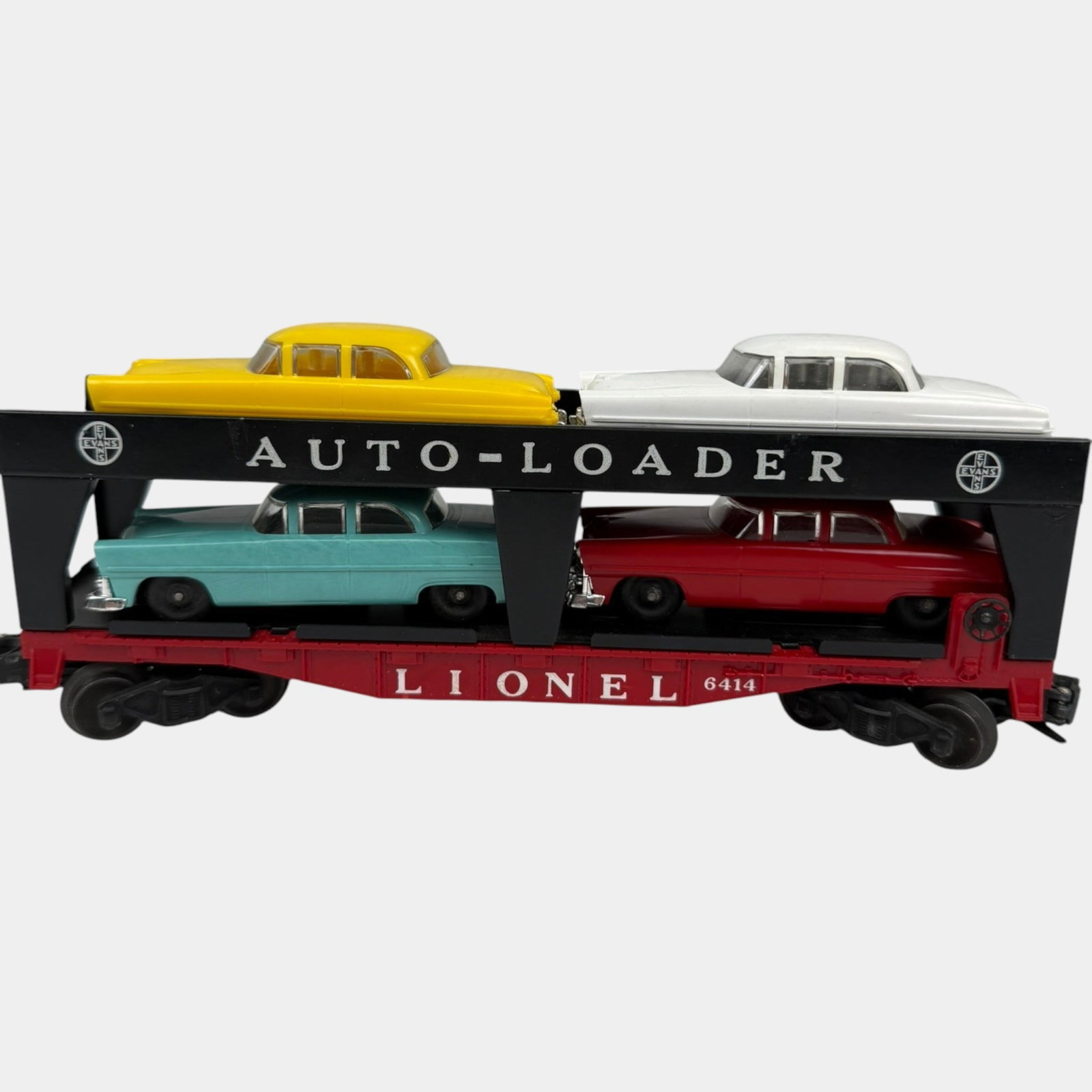 Lionel Trains Post War Auto Loader Train Car With 4 Multi Color Cars: Professional, fast, and affordable in house shipping available for all items. For higher resolution images please visit bid.craftedauctions.com Lionel Trains Post War Auto Loader Train Car With 4 Mult