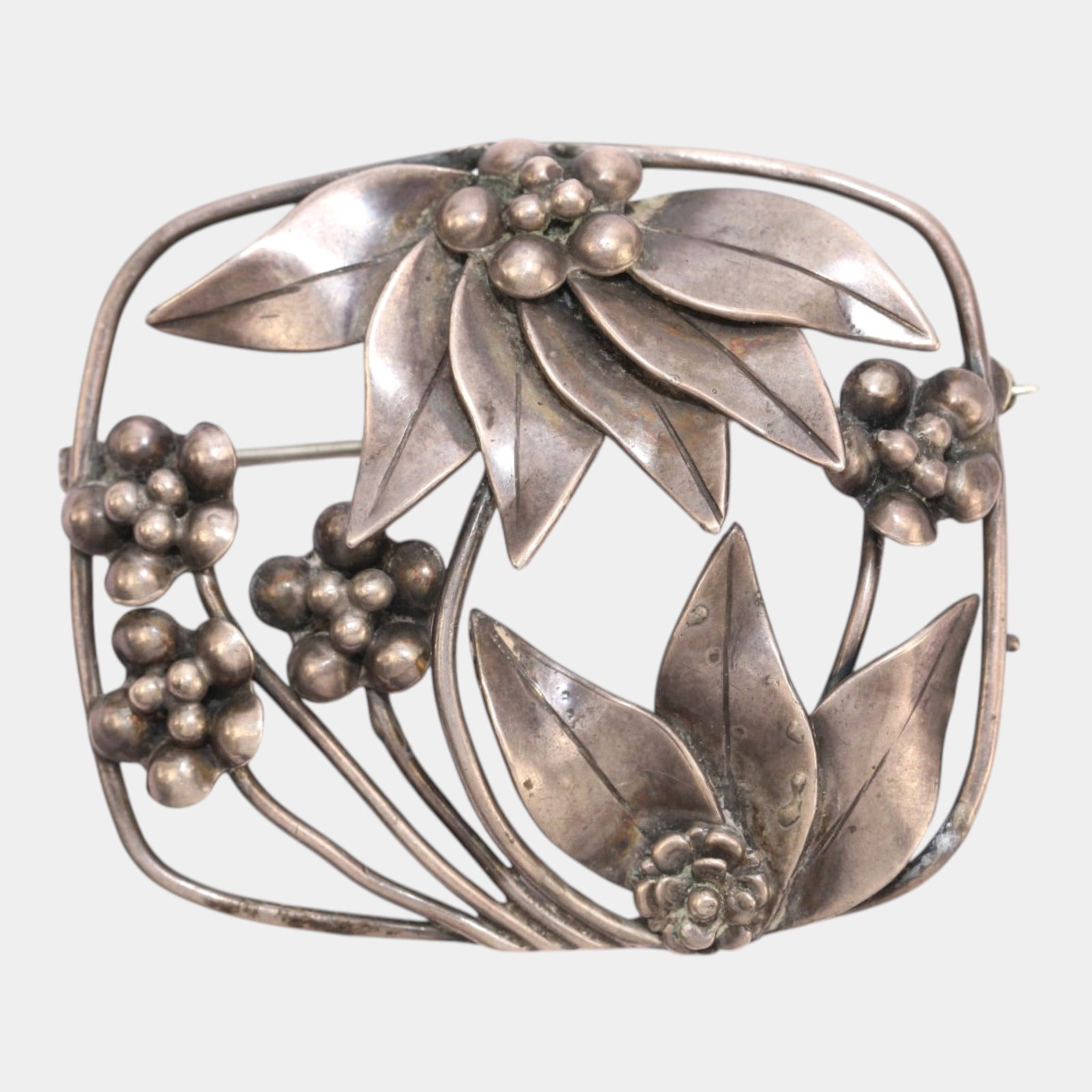 Hobe 1930s-1950s Mid Century Modernist Sterling Silver Framed Openwork Designer Brooch: Professional, fast, and affordable in house shipping available for all items. For higher resolution images please visit bid.craftedauctions.com Boldly sculptural and elegantly organic, this Hobe sterl