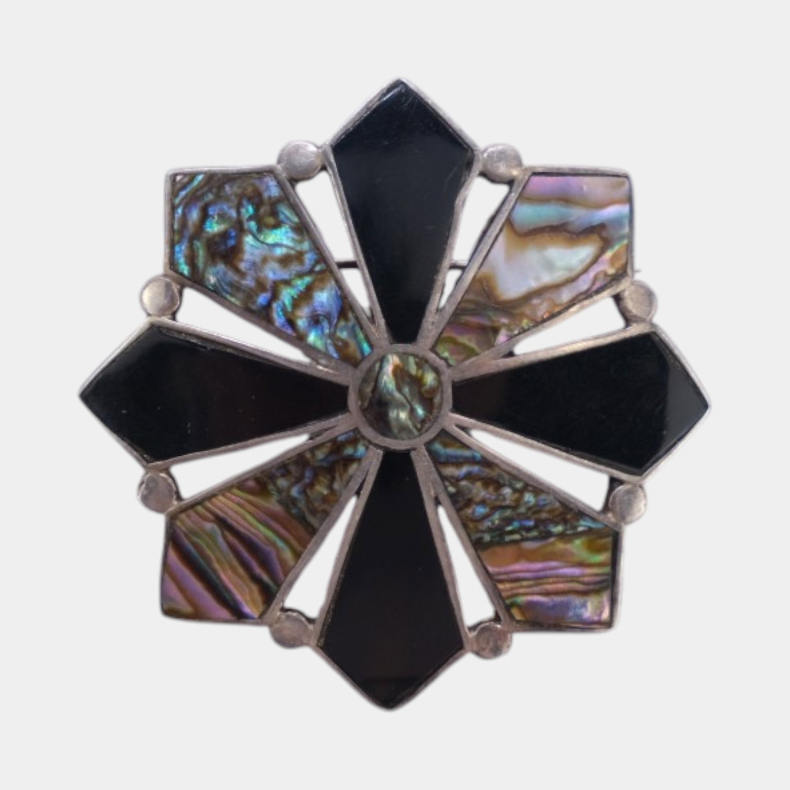 L Narvaez For Taxco Sterling Silver 925 Mid Century Abalone & Black Onyx Geometric Star Brooch: Professional, fast, and affordable in house shipping available for all items. For higher resolution images please visit bid.craftedauctions.com Boldly geometric and richly iridescent, this Taxco sterl