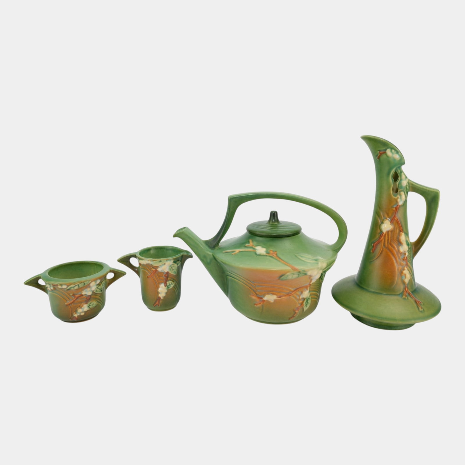 Roseville Snowberry Green 1947 Mid Century Modern Ewer Teapot Cup Creamer: Professional, fast, and affordable in house shipping available for all items. For higher resolution images please visit bid.craftedauctions.com Roseville Snowberry Green 1947 Mid Century Modern Ewer T