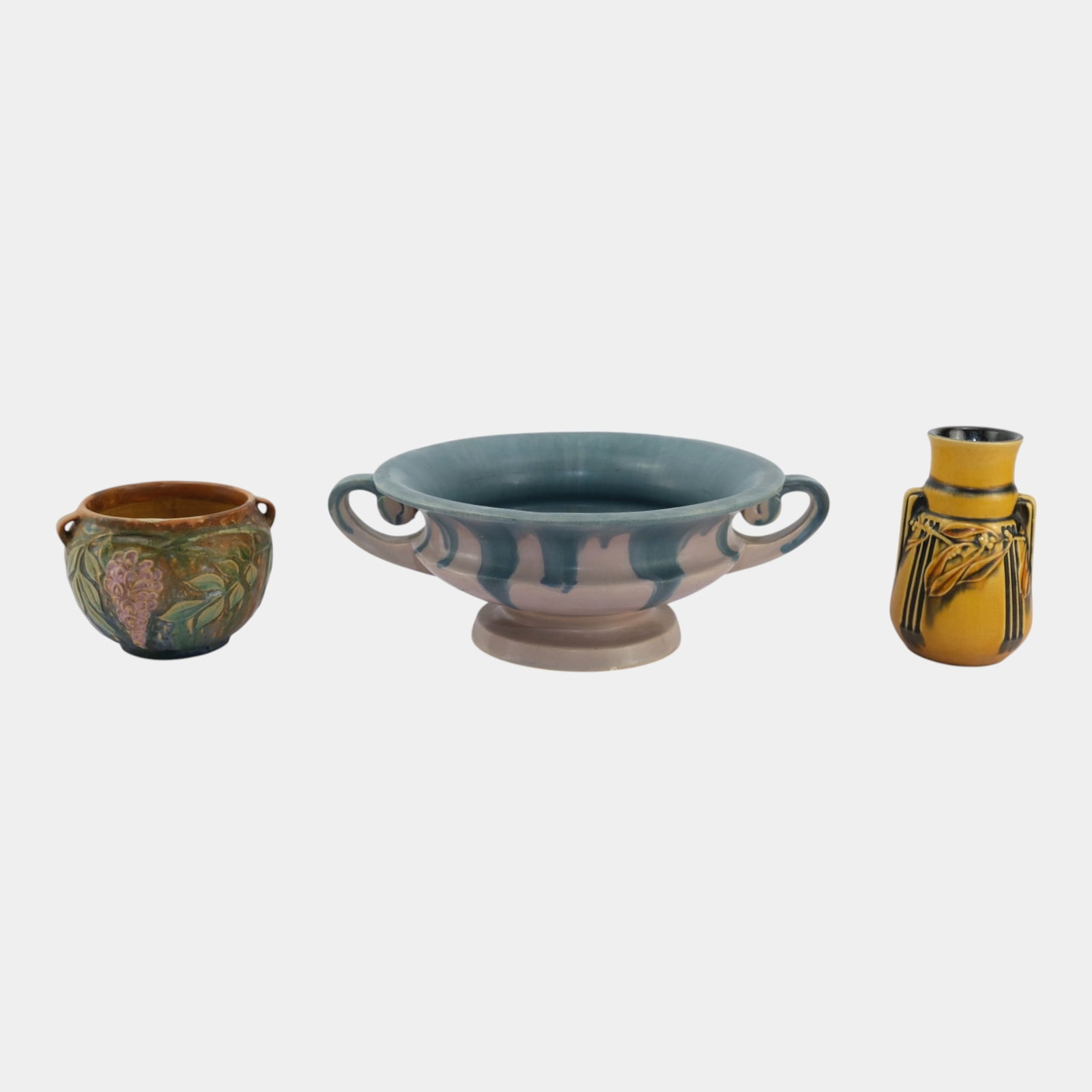 Roseville Early 20th Century Art Pottery Carnelian Wisteria Laurel Bowl Jardiniere Vase: Professional, fast, and affordable in house shipping available for all items. For higher resolution images please visit bid.craftedauctions.com Roseville Early 20th Century Art Pottery Carnelian Wiste