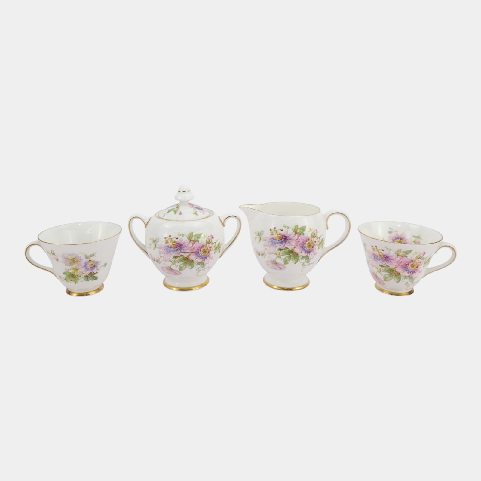 Royal Doulton 1940s English Bone China "Passion Flower" Teacups, Creamer, & Sugar Bowl: Professional, fast, and affordable in house shipping available for all items. For higher resolution images please visit bid.craftedauctions.com Royal Doulton 1940s English Bone China "Passion Flower" 