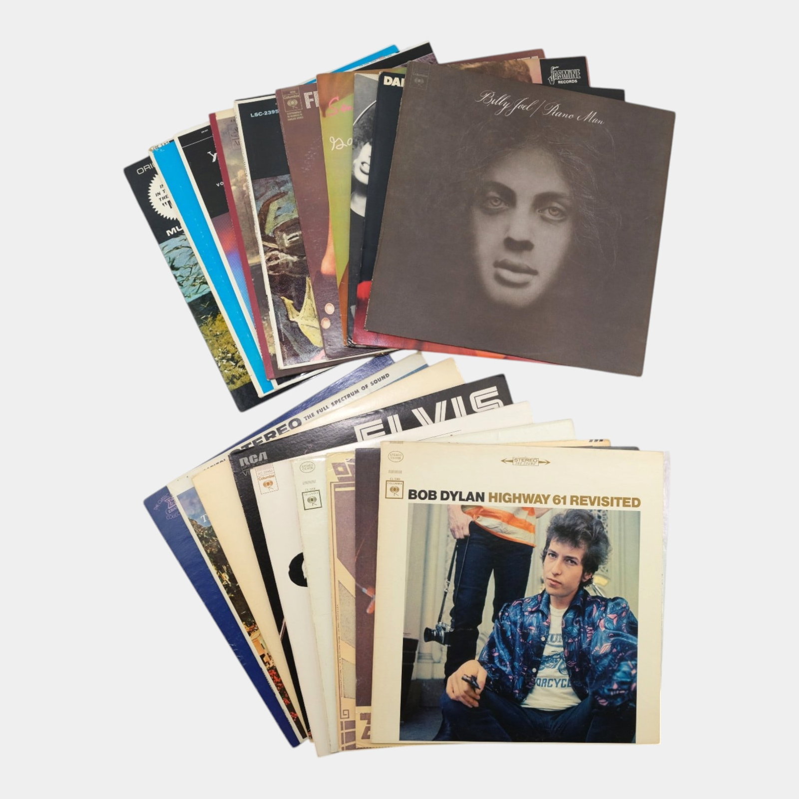 Bob Dylan, Elvis Presley, Billy Joel, & Other Rock & Roll & World Music Original Vinyl Records: Professional, fast, and affordable in house shipping available for all items. For higher resolution images please visit bid.craftedauctions.com Bob Dylan, Elvis Presley, Billy Joel, & Other Rock & Rol