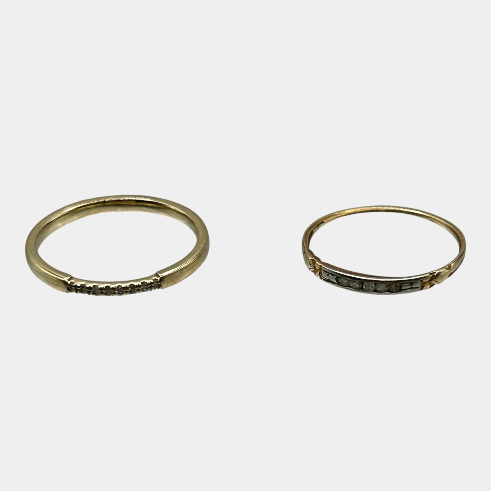 14K Yellow Gold And Diamond Slim Band Stackable Ring Pair: Professional, fast, and affordable in house shipping available for all items. For higher resolution images please visit bid.craftedauctions.com Elegantly matched pair of 14K gold diamond band rings fe