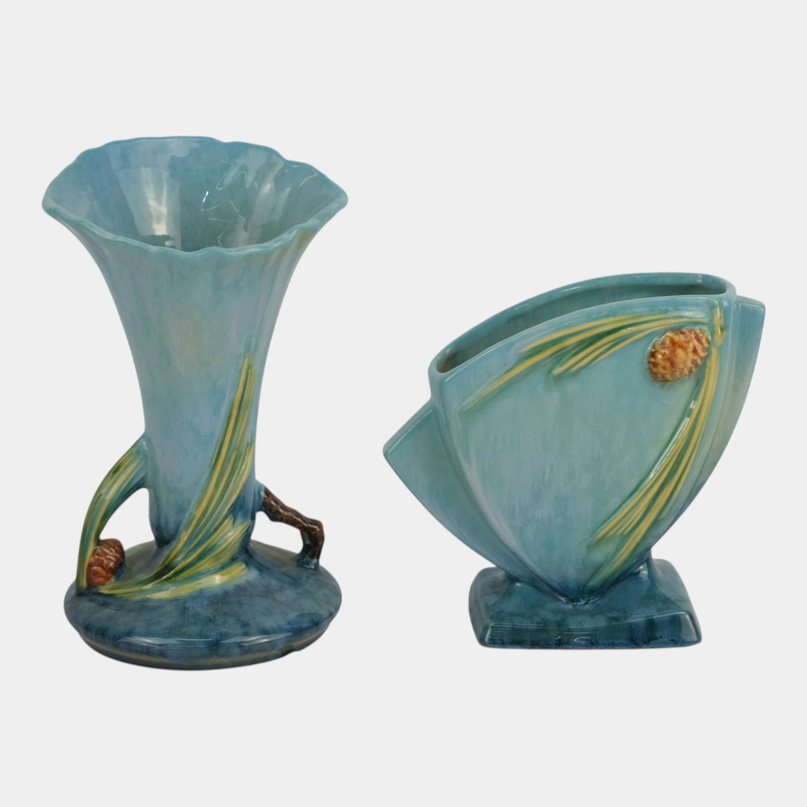 Roseville Wincraft Blue 1948 Mid Century Modern Pottery Pine Cone Motif Handled Vases: Professional, fast, and affordable in house shipping available for all items. For higher resolution images please visit bid.craftedauctions.com Roseville Wincraft Blue 1948 Mid Century Modern Pottery 
