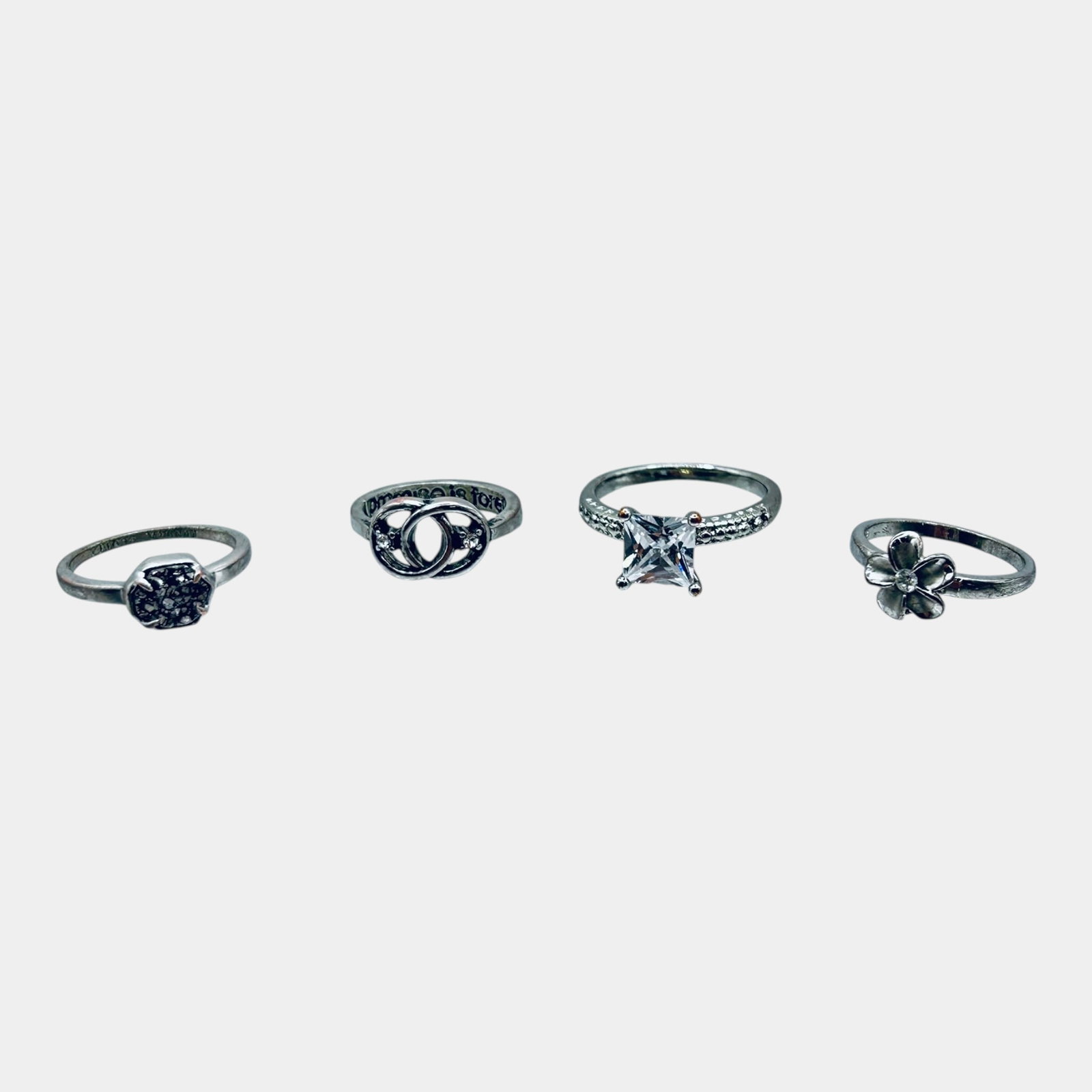Kendra Scott And Other Fashion Ring Group Including Infinity Star And Floral Rings: Professional, fast, and affordable in house shipping available for all items. For higher resolution images please visit bid.craftedauctions.com Excellent condition. Age related wear. Marked as shown. 