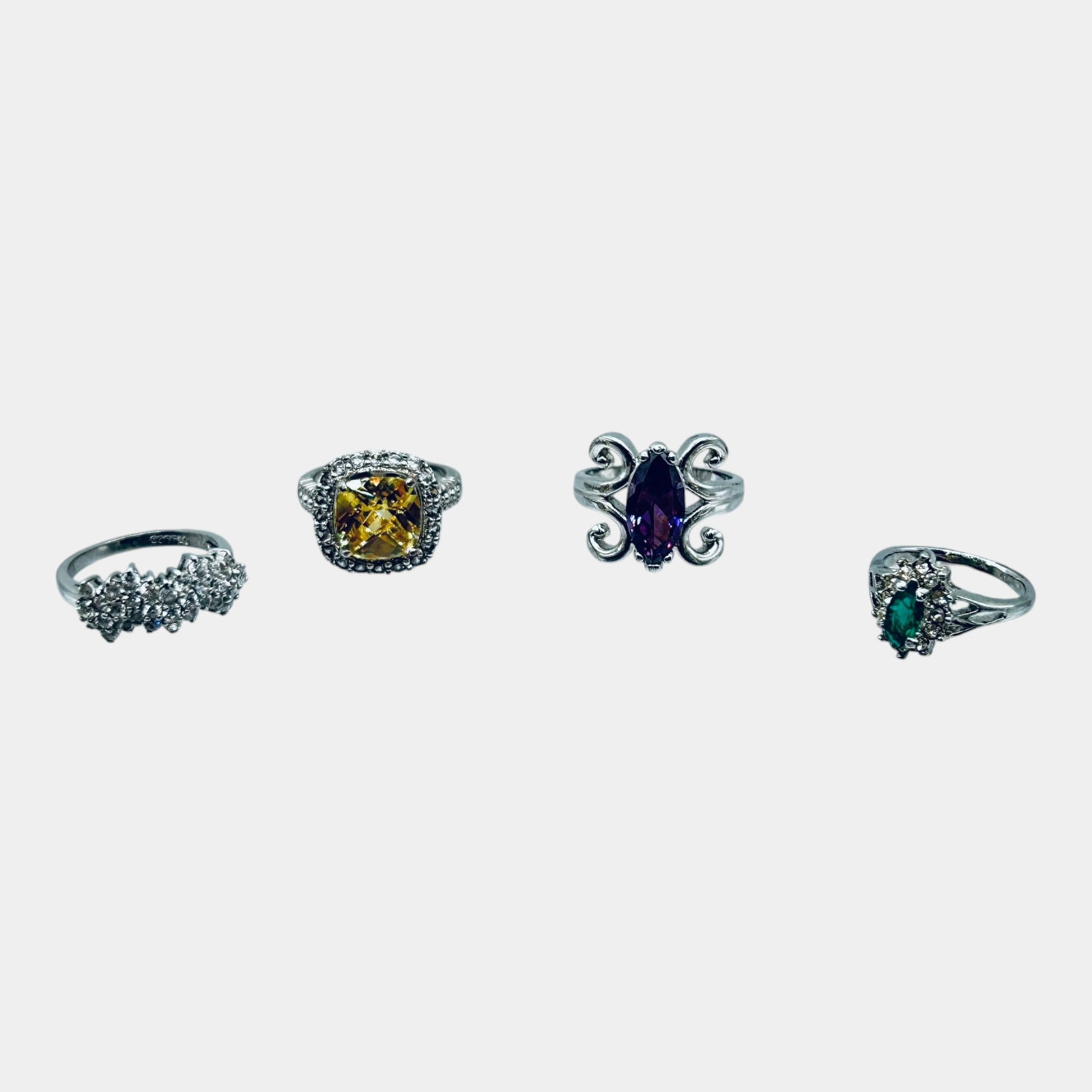 Vintage Silver-Tone Fashion Ring Group With Yellow Blue And Purple Colored Stone Designs: Professional, fast, and affordable in house shipping available for all items. For higher resolution images please visit bid.craftedauctions.com Excellent condition. Age related wear. Largest item is r