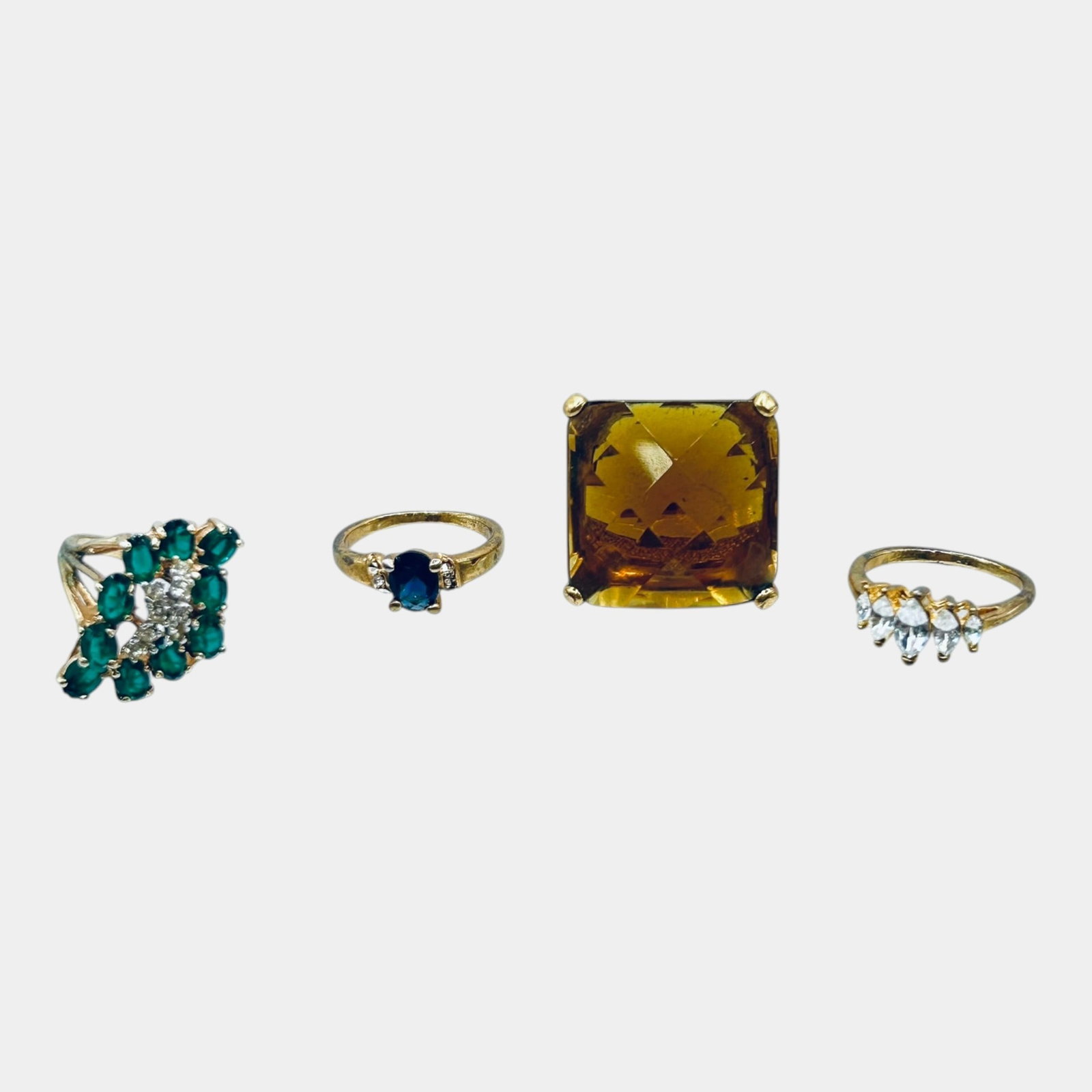 Vintage Gold Tone Fashion Ring Group With Green Blue And Amber Colored Stones: Professional, fast, and affordable in house shipping available for all items. For higher resolution images please visit bid.craftedauctions.com Excellent condition. Age related wear. Marked as shown. 