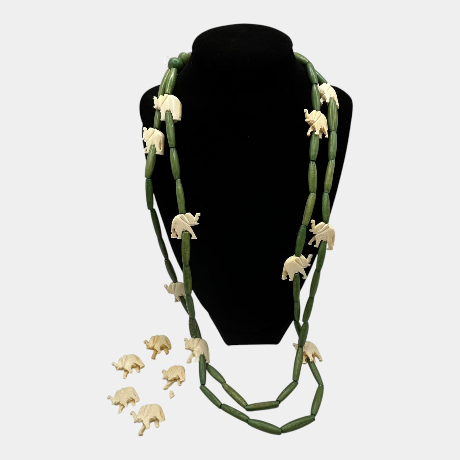 Vintage Carved Figural Bone Carved Elephant & Green Bead Double Strand Necklace 36 Inches: Professional, fast, and affordable in house shipping available for all items. For higher resolution images please visit bid.craftedauctions.com Excellent condition. Age related wear. Tested and guaran