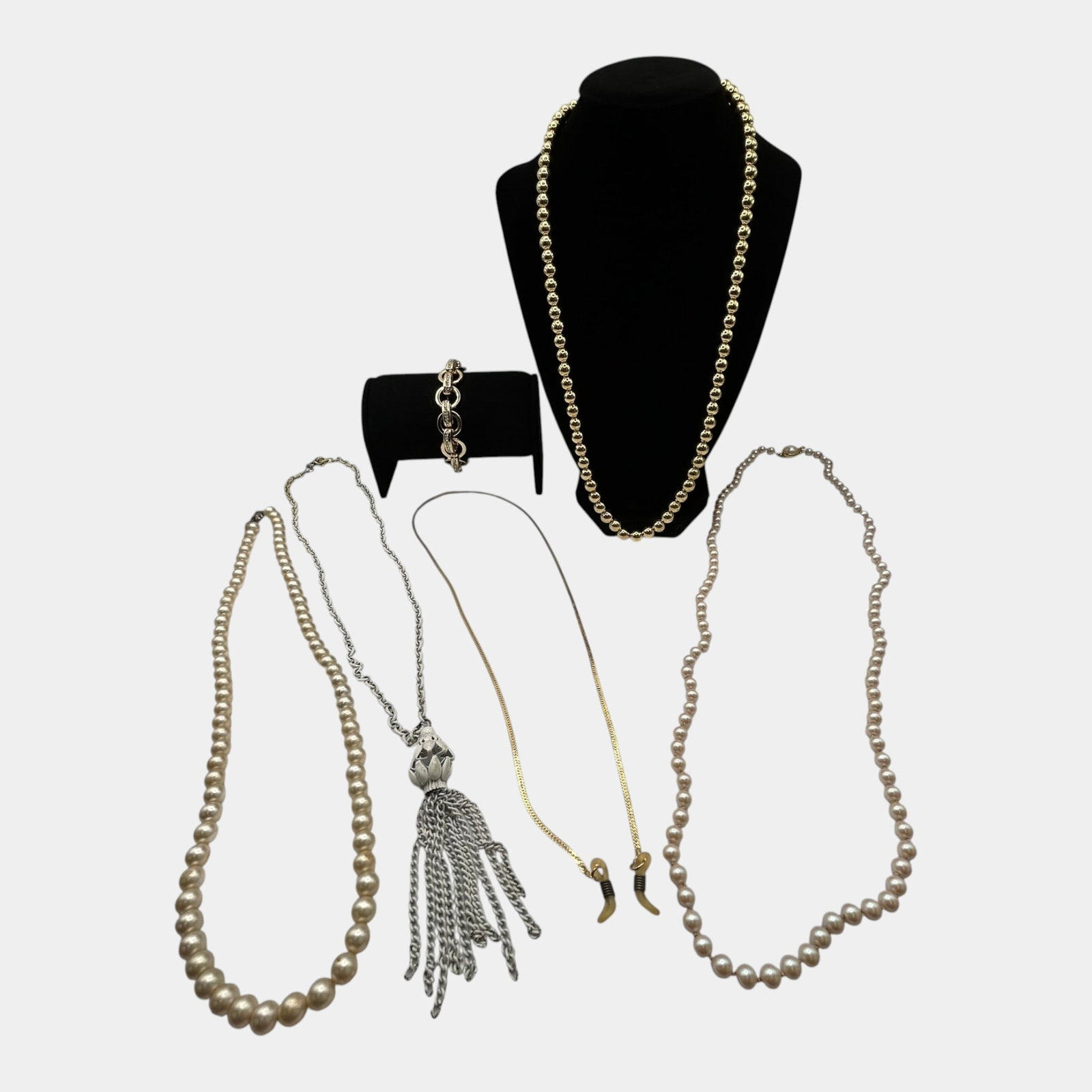 Faux Pearl Necklace Collection With Tassel Pendant Necklace And Link Style Bracelet: Professional, fast, and affordable in house shipping available for all items. For higher resolution images please visit bid.craftedauctions.com Excellent condition. Age related wear. Clasp is missing 