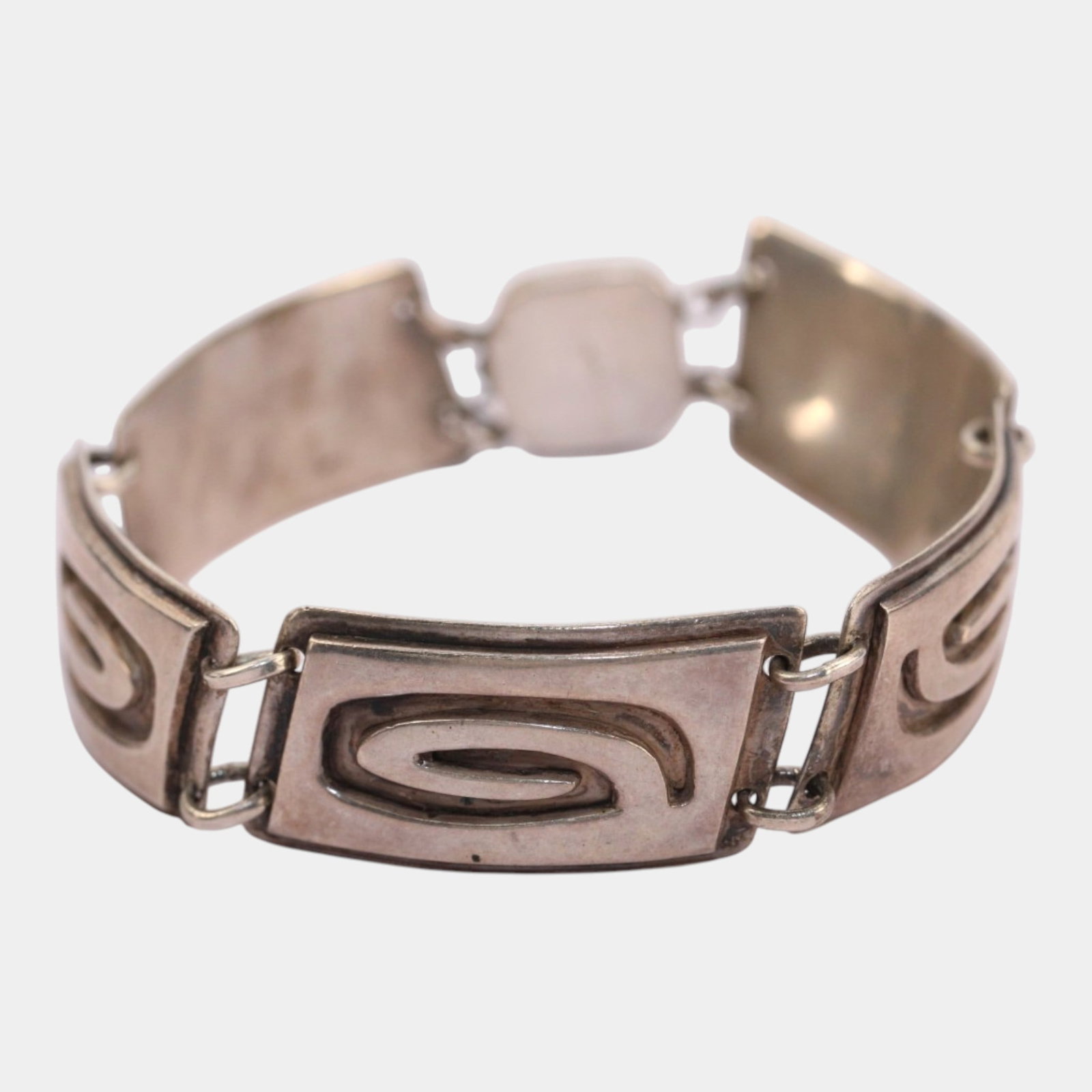 Fridl Blumenthal (1905-1998) Mid Century Modernist Sterling Silver Abstract Swirl Link Bracelet: Professional, fast, and affordable in house shipping available for all items. For higher resolution images please visit bid.craftedauctions.com Elegantly sculptural and distinctly modernist, this Frid