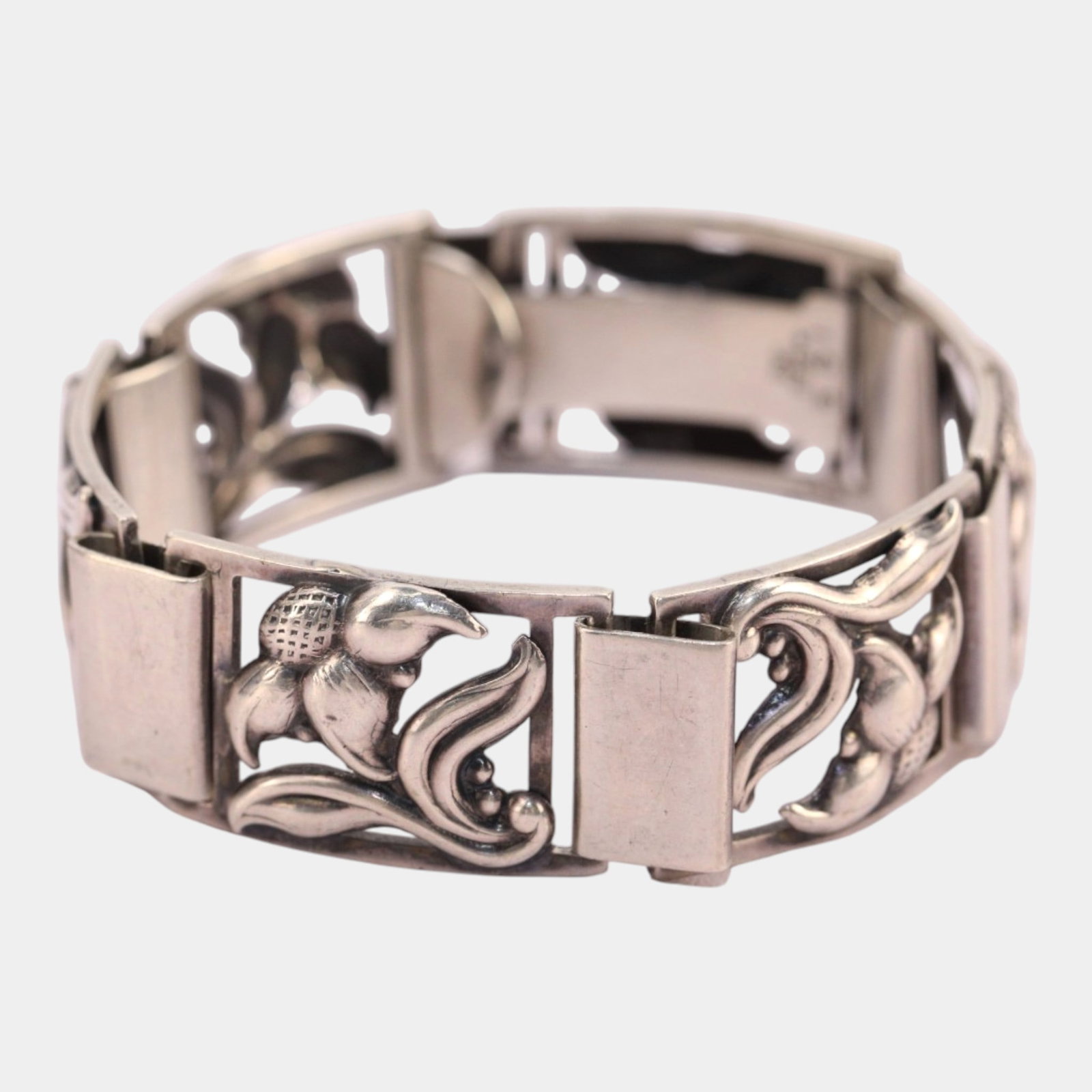Danish RR 830 Silver 1940s Floral Decorated Panel Mid Century Modern Link Bracelet: Professional, fast, and affordable in house shipping available for all items. For higher resolution images please visit bid.craftedauctions.com Elegantly sculptural and richly detailed, this Danish RR