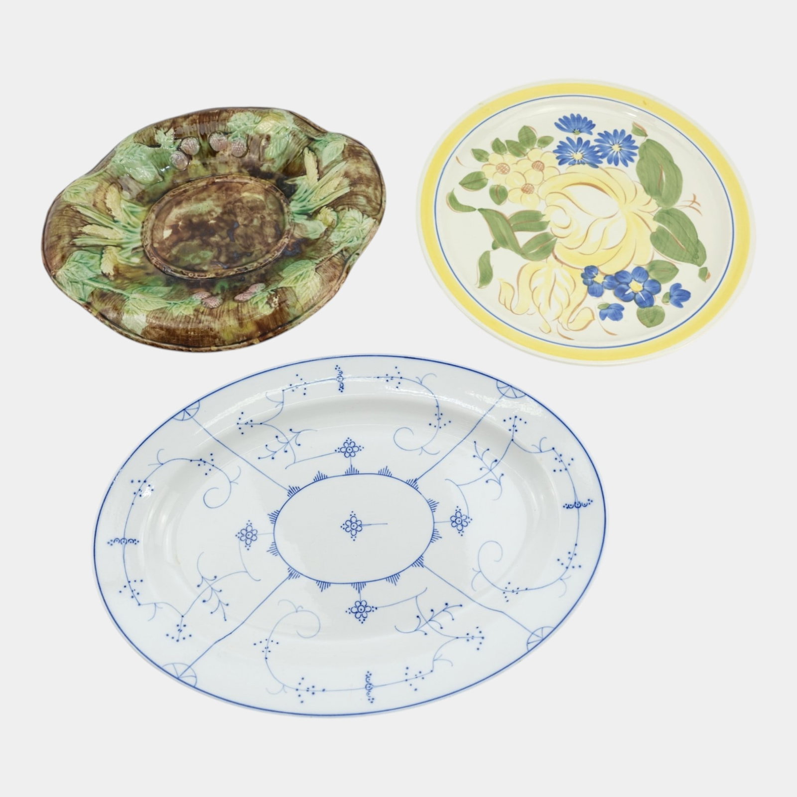 Villeroy & Boch Blue Art Deco Oval Floral Tray, Majolica Raspberry Platter, And Red Wing Floral: Professional, fast, and affordable in house shipping available for all items. For higher resolution images please visit bid.craftedauctions.com Villeroy & Boch Blue Art Deco Oval Floral Tray, Majolica