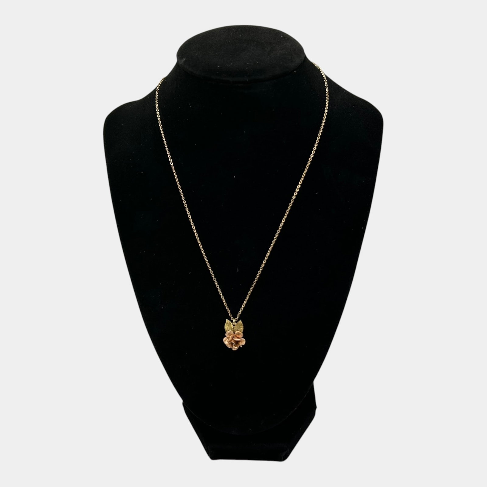 14K Yellow Gold Floral Pendant Necklace With Sculpted Rose Blossom And Leaf Design: Professional, fast, and affordable in house shipping available for all items. For higher resolution images please visit bid.craftedauctions.com Delicate 14K gold necklace featuring a beautifully sculp