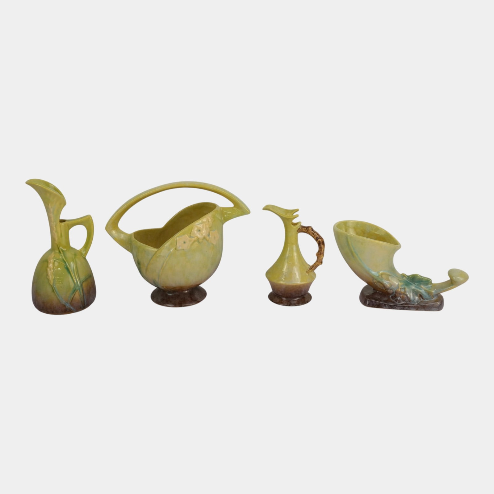 Roseville Wincraft Green 1948 Mid Century Modern Pottery Floral Decorated Vases And Twig Handle Ewer: Professional, fast, and affordable in house shipping available for all items. For higher resolution images please visit bid.craftedauctions.com Roseville Wincraft Green 1948 Mid Century Modern Pottery