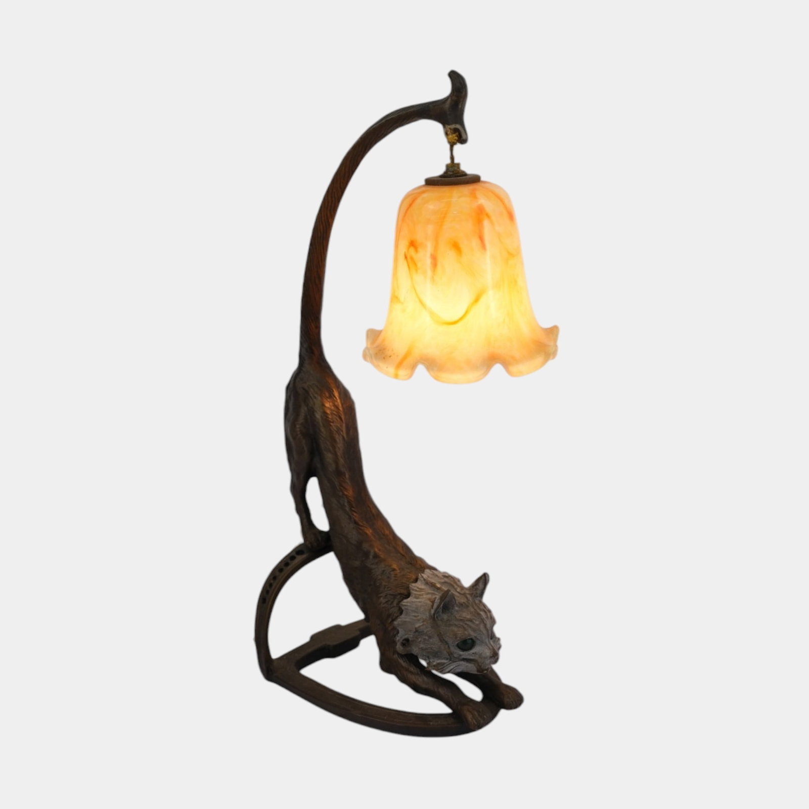 Bronze Art Nouveau Crouching Cat Figural Lamp With Amber Art Glass Shade: Professional, fast, and affordable in house shipping available for all items. For higher resolution images please visit bid.craftedauctions.com Bronze Art Nouveau Crouching Cat Figural Lamp With Amber